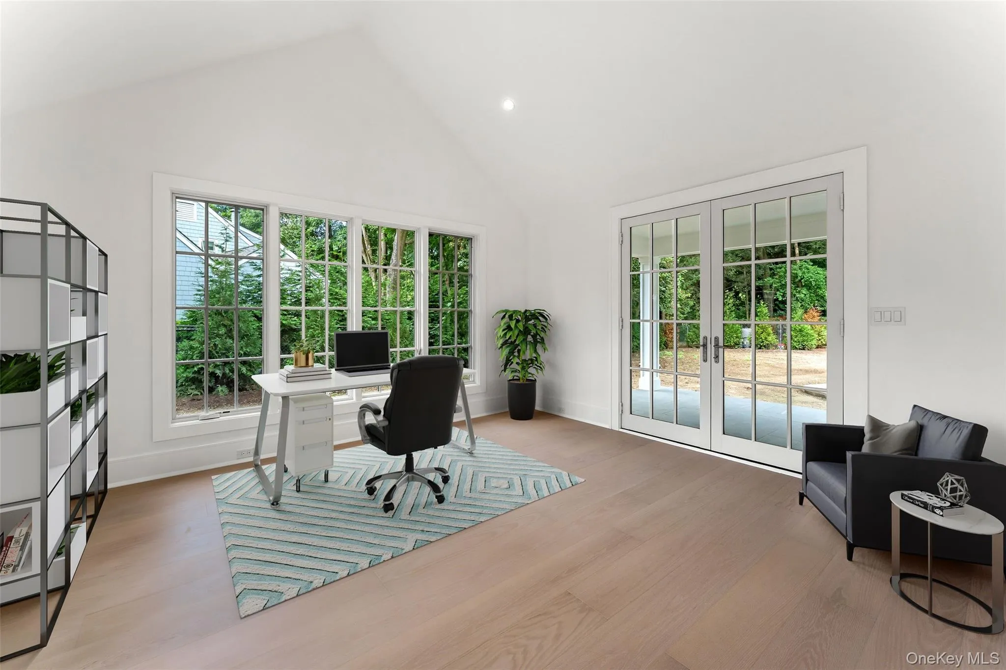 First floor library with french doors to the covered patio First floor library with french doors to the covered patio