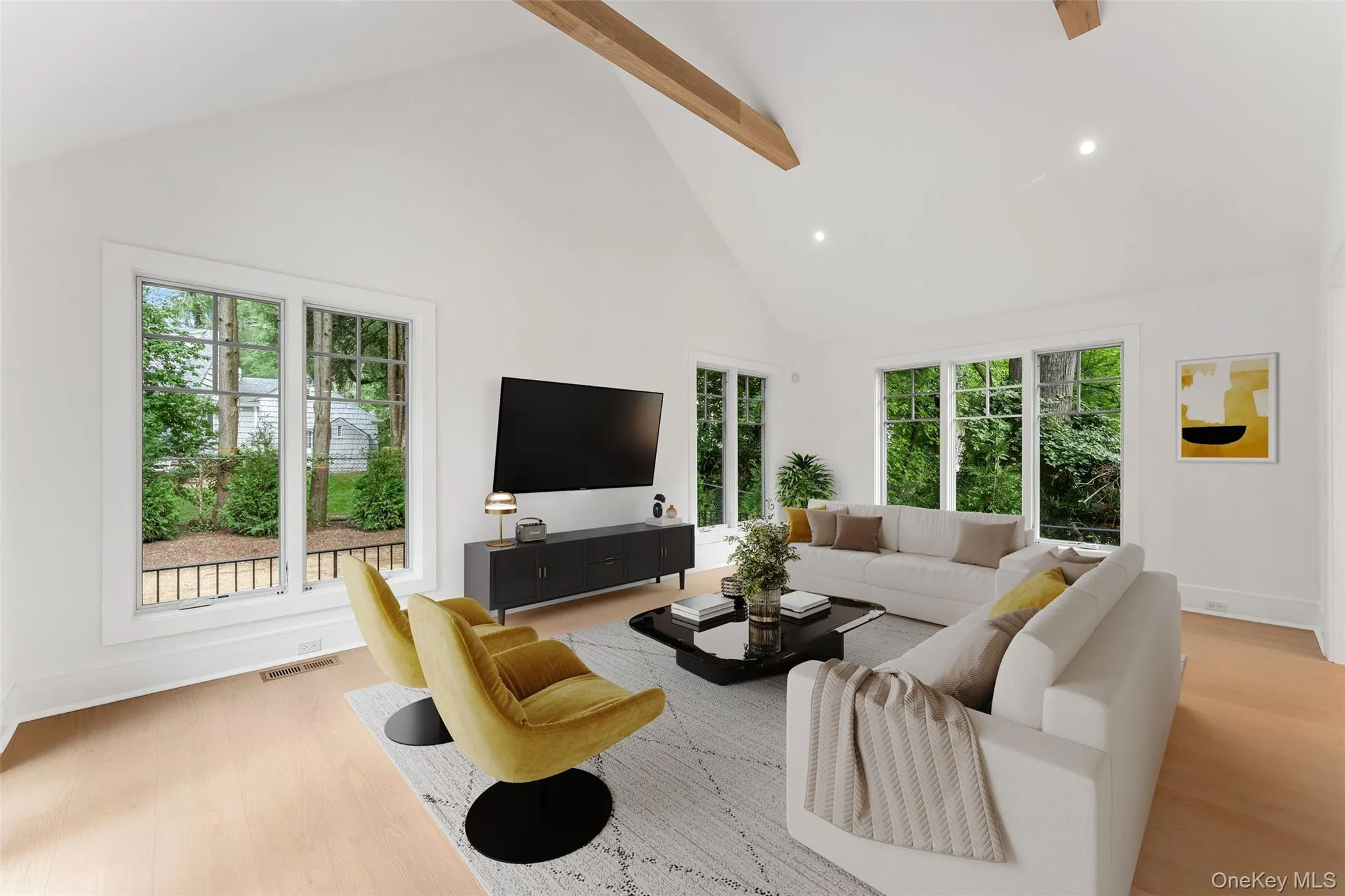 Family Room off kitchen with cathedral ceilings virtually staged Family Room off kitchen with cathedral ceilings virtually staged