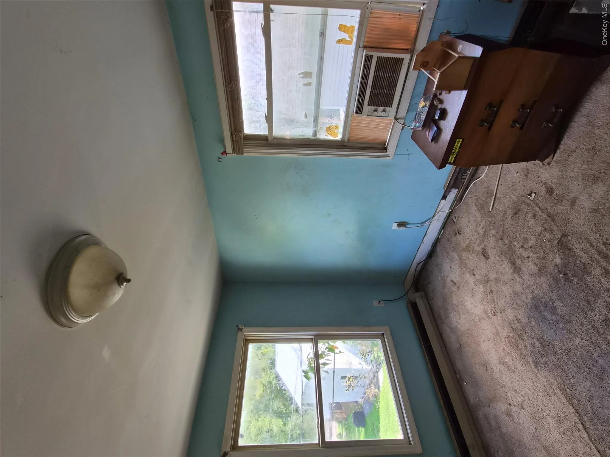 Bedroom 2 with wall to wall carpeting and two windows. Bedroom 2 with wall to wall carpeting and two windows.