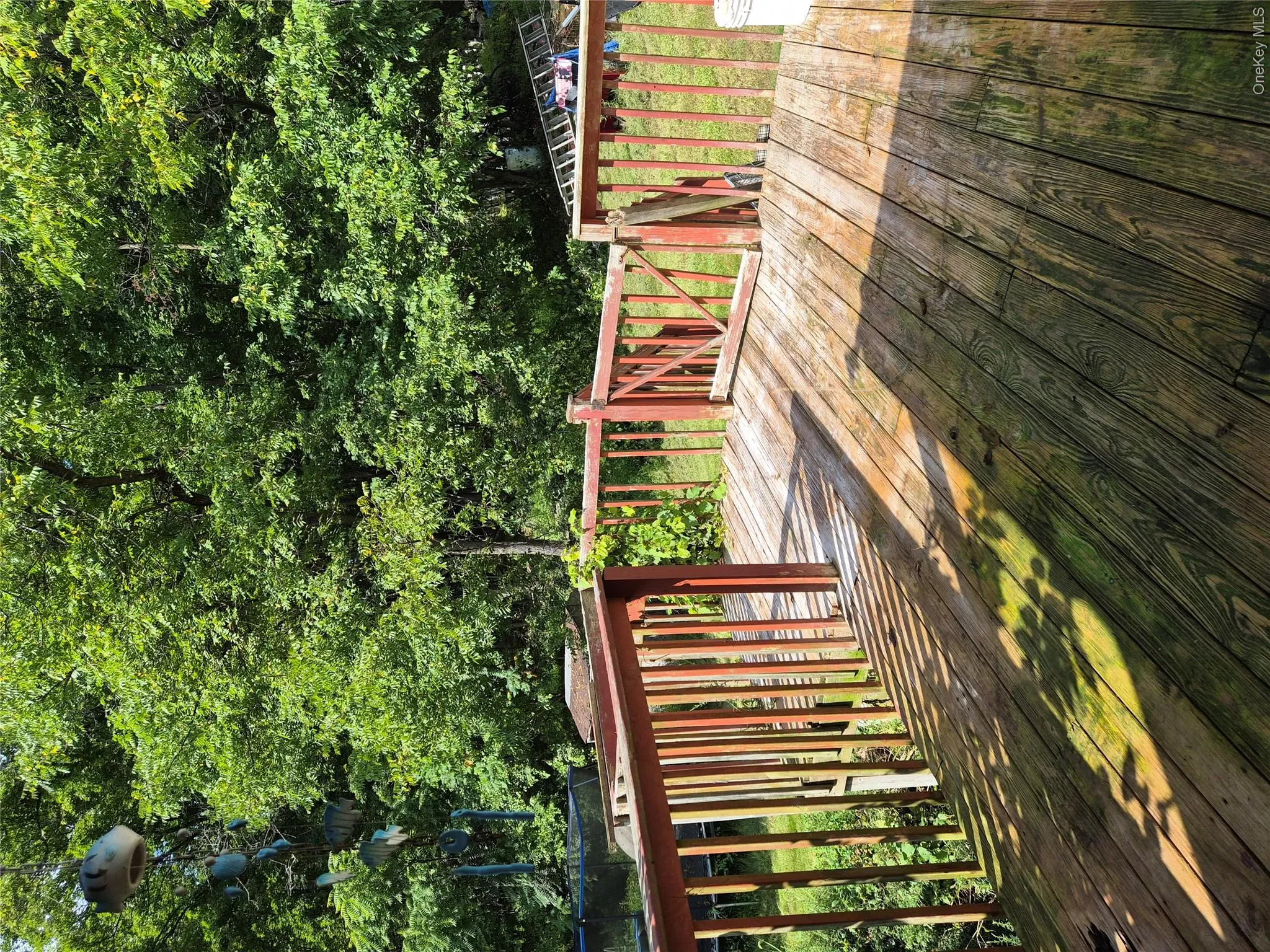 Back porch looking onto lush green yard Back porch looking onto lush green yard