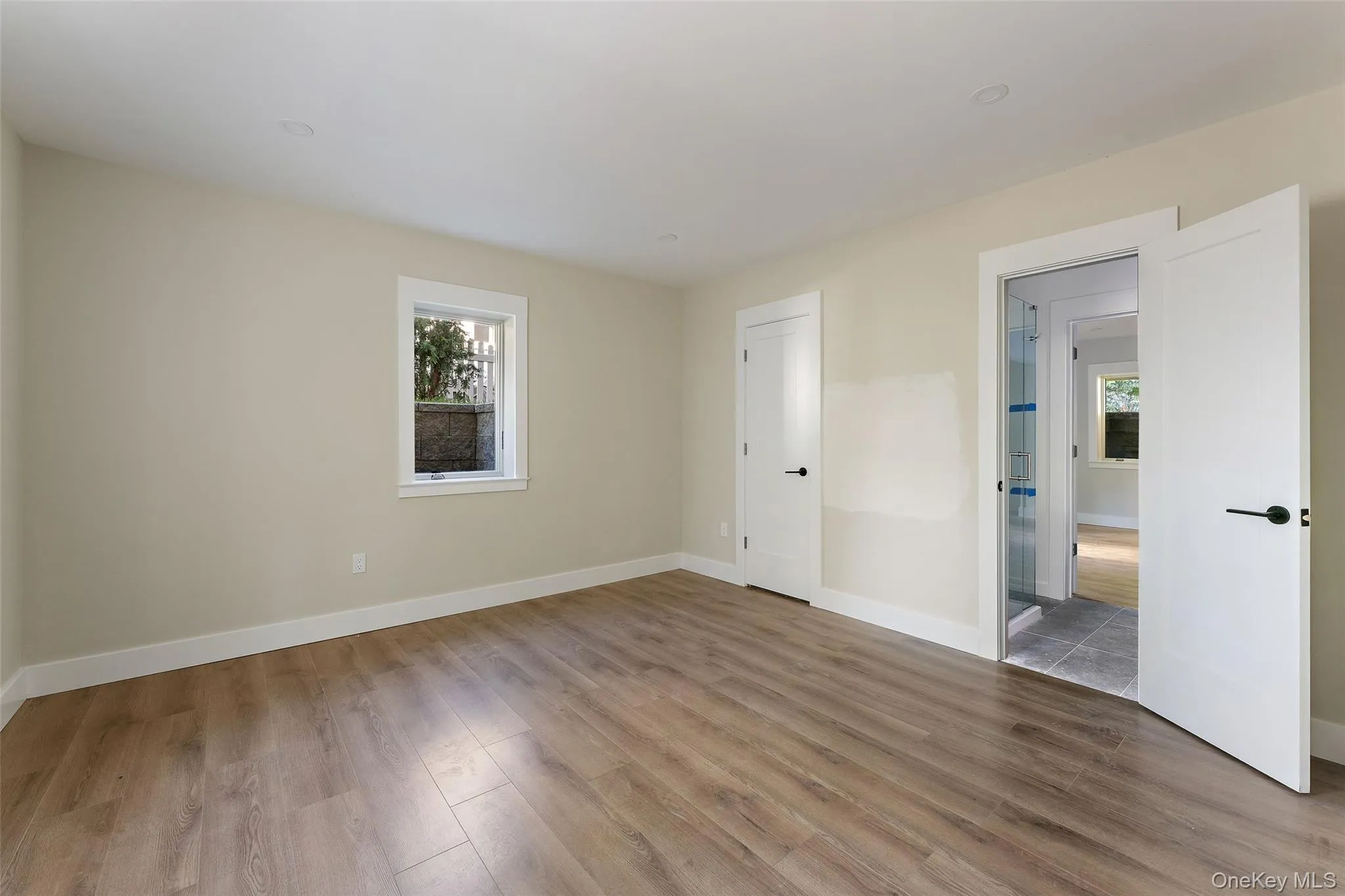 Bedroom #5 in basement with ensuite bathroom and closet. Bedroom #5 in basement with ensuite bathroom and closet.