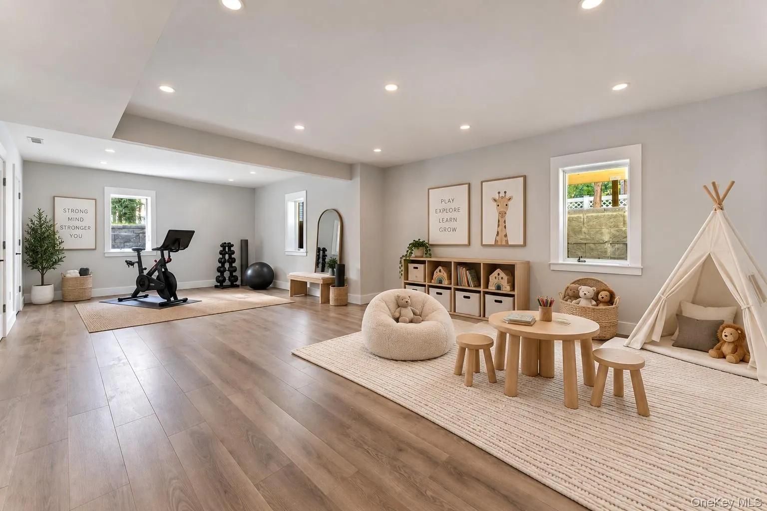 Large open space in basement virtually staged as an exercise room and play space. Large open space in basement virtually staged as an exercise room and play space.