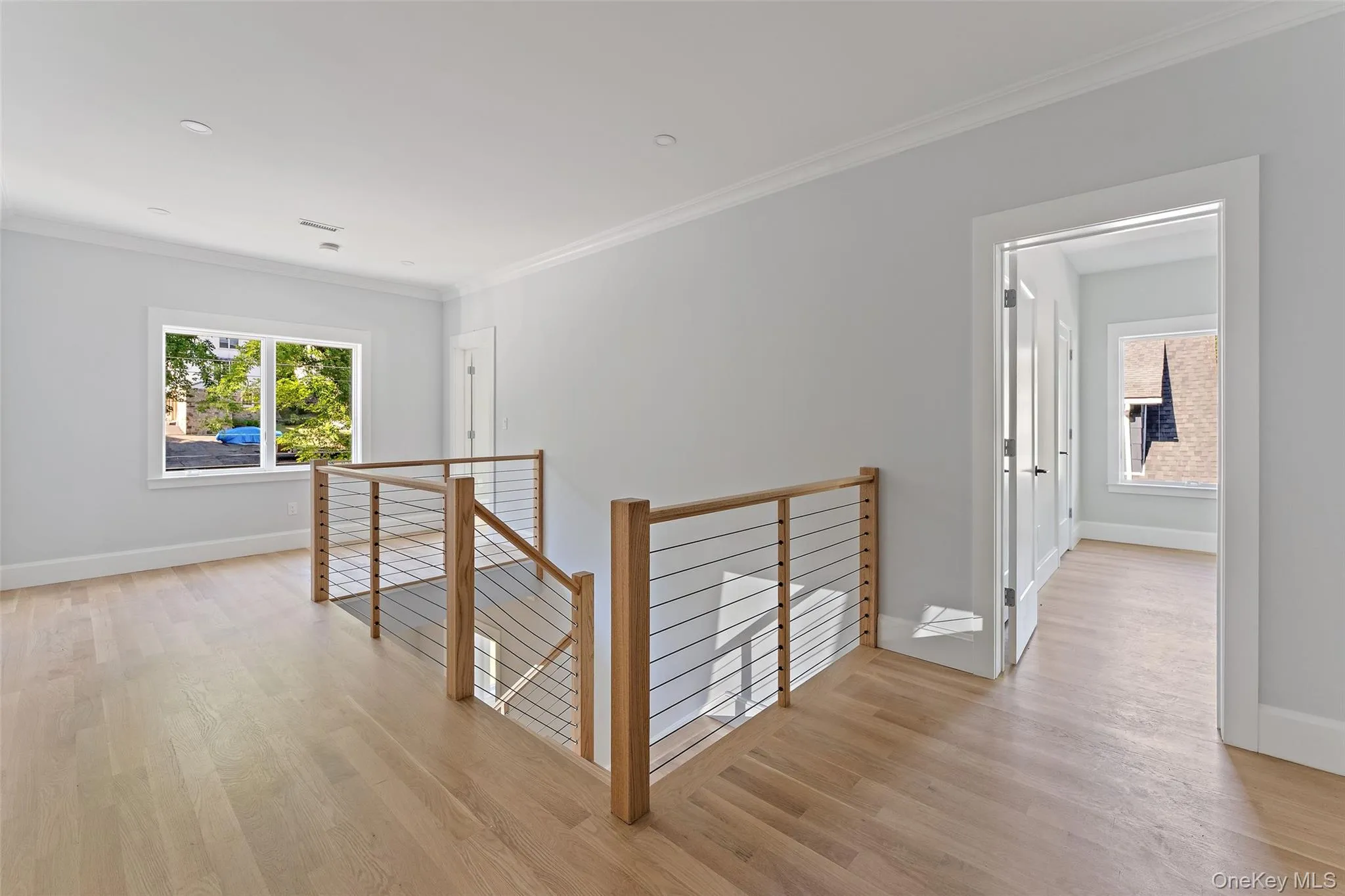 Second floor landing. Beautiful wood railings with cable wire. Second floor landing. Beautiful wood railings with cable wire.