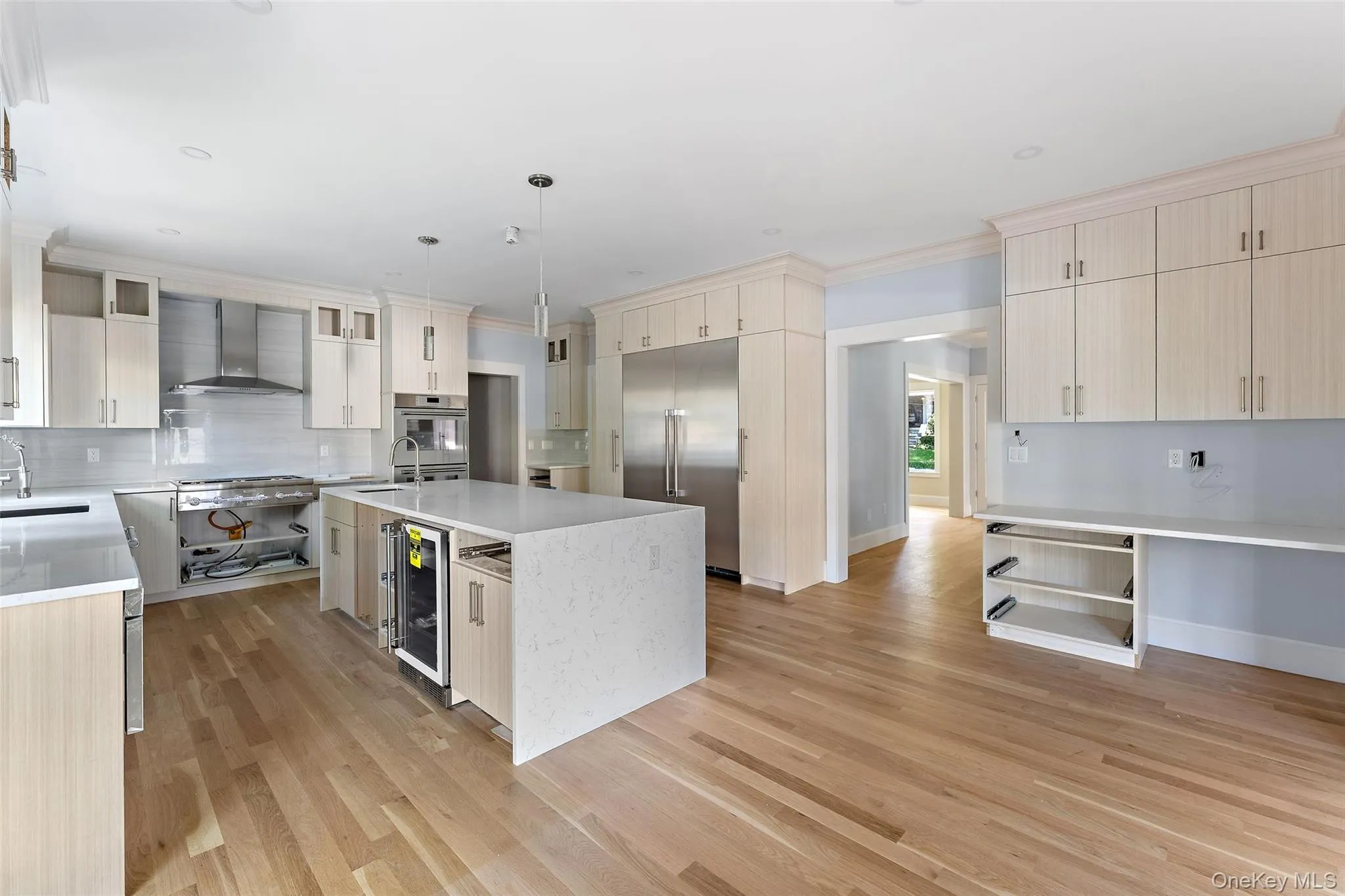 Generously sized kitchen with island, 2 sinks, Thermador appliances. Eat in kitchen space and built in desk area. Cabinetry almost complete - waiting on final pieces. Generously sized kitchen with island, 2 sinks, Thermador appliances. Eat in kitchen space and built in desk area. Cabinetry almost complete - waiting on final pieces.