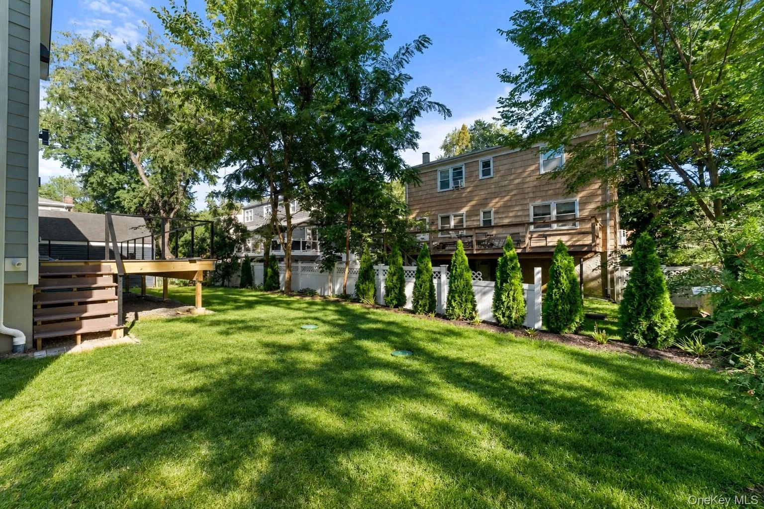 Back/side yard.*Grass has been virtually edited. Back/side yard.*Grass has been virtually edited.
