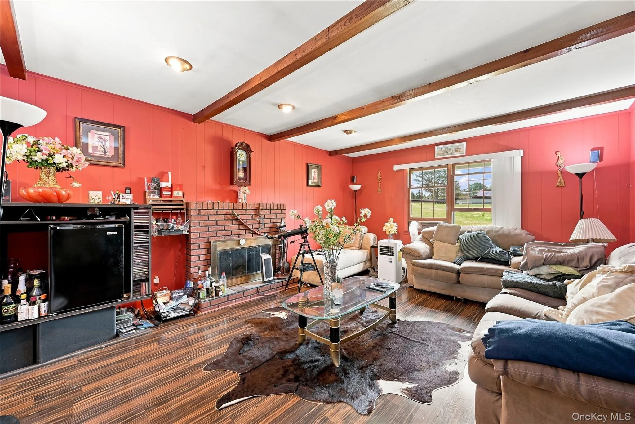 Den with wood burning fireplace Den with wood burning fireplace
