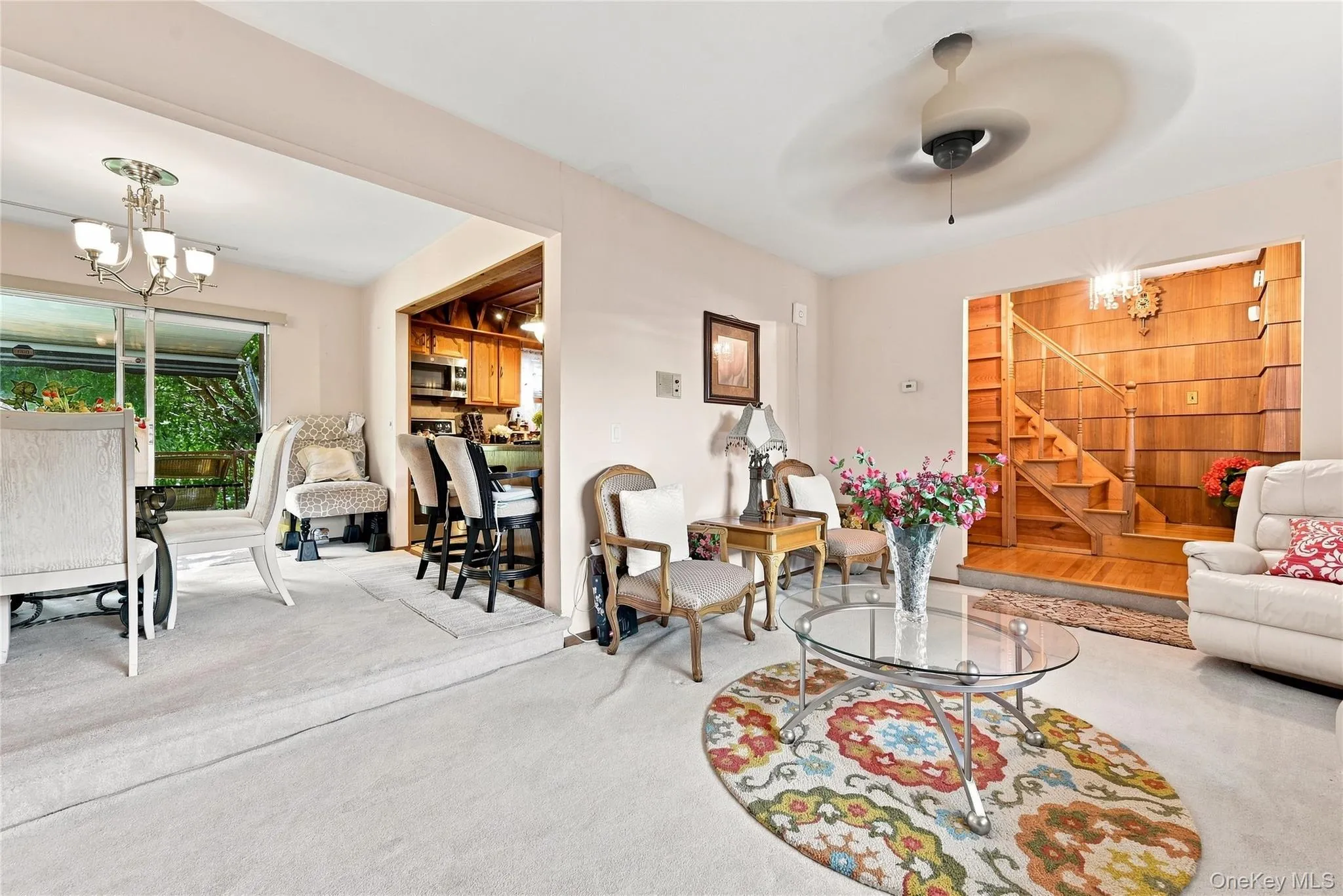 Living room adjoining dining area and kitchen Living room adjoining dining area and kitchen