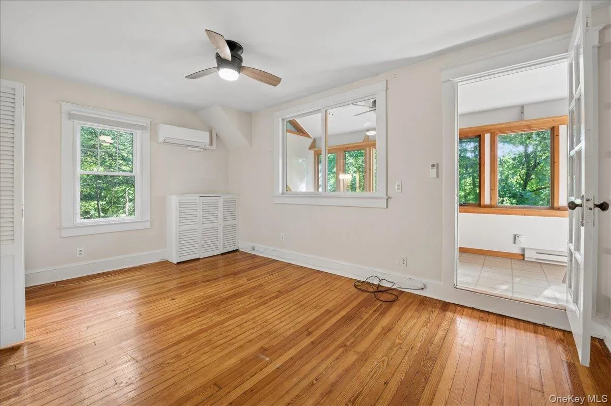 Main floor primary bedroom into enclosed four season porch Main floor primary bedroom into enclosed four season porch