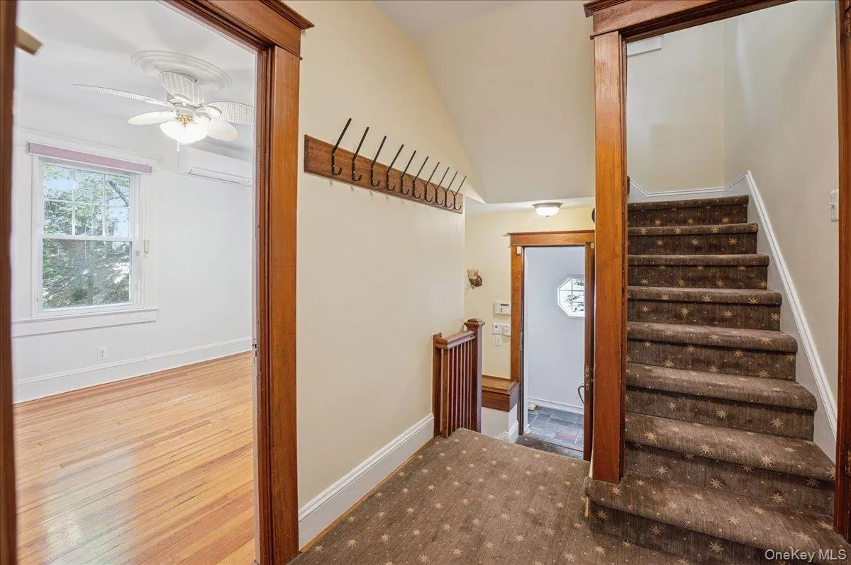 Hallway and stairs to upper level Hallway and stairs to upper level