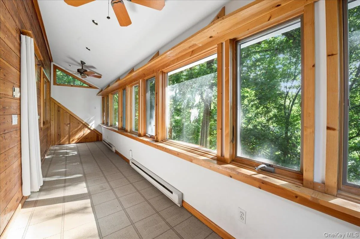 Main floor enclosed four season porch Northeast view Main floor enclosed four season porch Northeast view