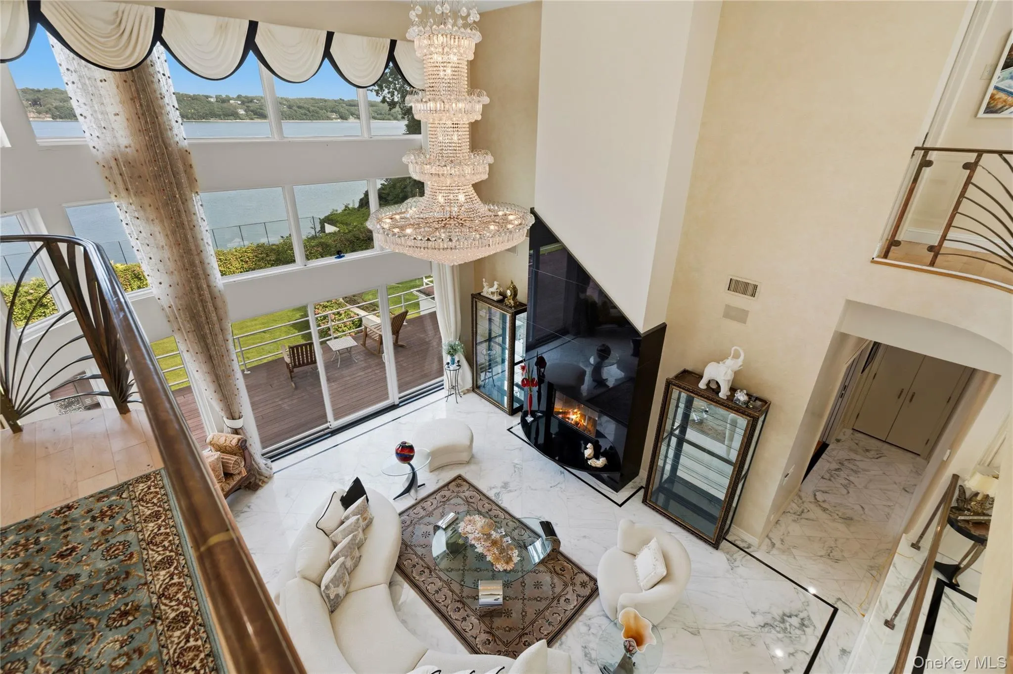 Soaring ceilings and floor-to-ceiling windows showcasing panoramic water views Soaring ceilings and floor-to-ceiling windows showcasing panoramic water views