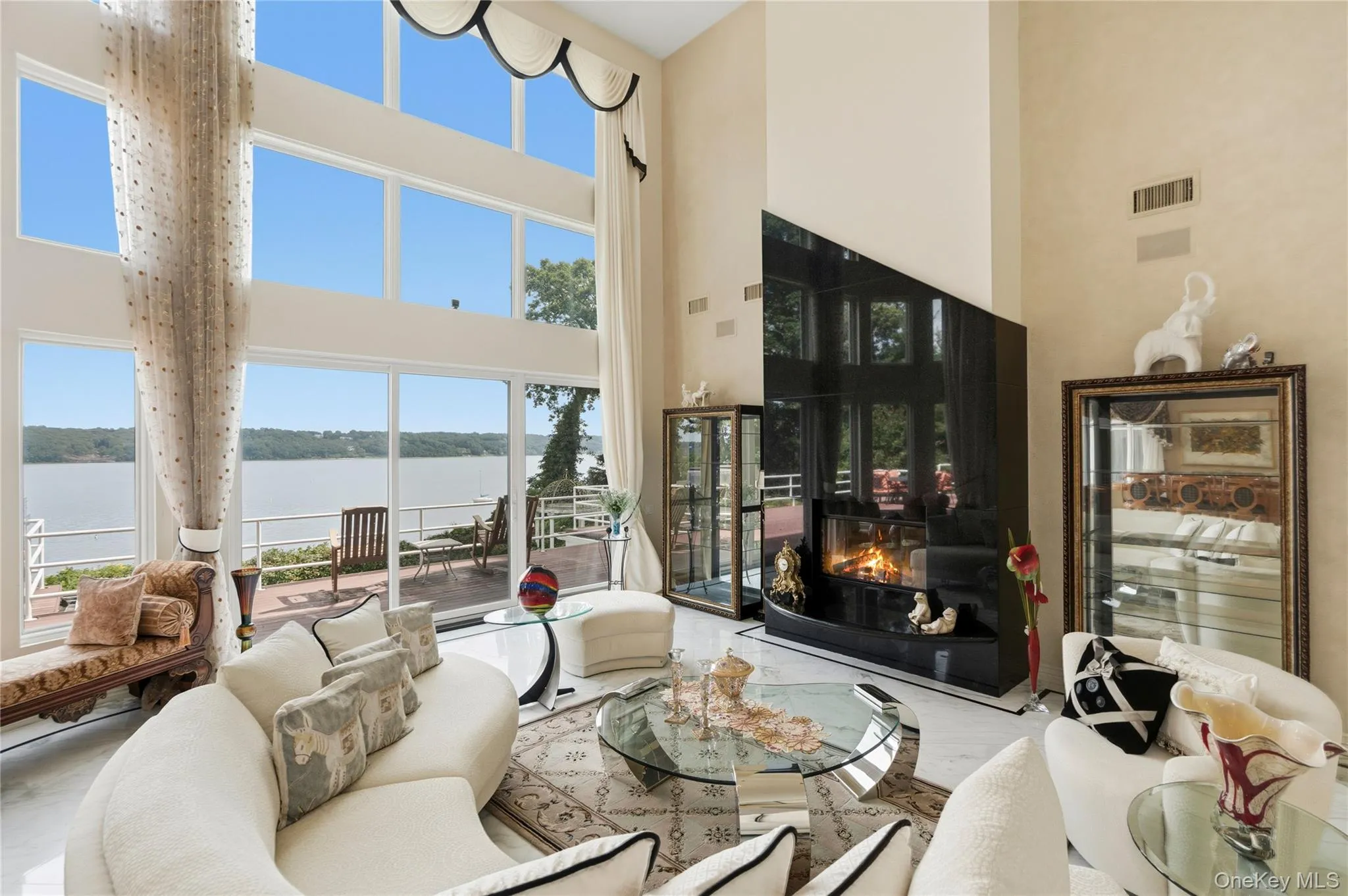 Great room, walls of glass-panoramic water-views Great room, walls of glass-panoramic water-views