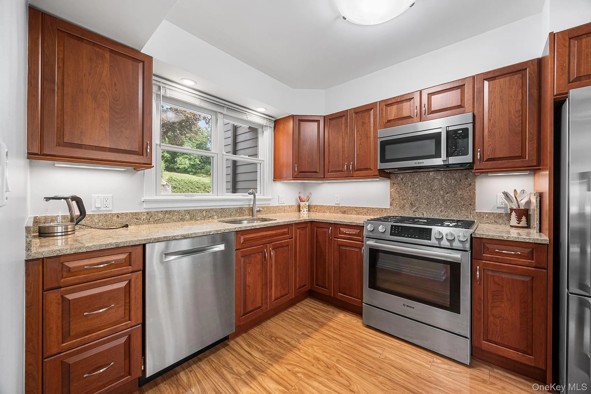 Kitchen with abundant storage and SS appliances. Kitchen with abundant storage and SS appliances.