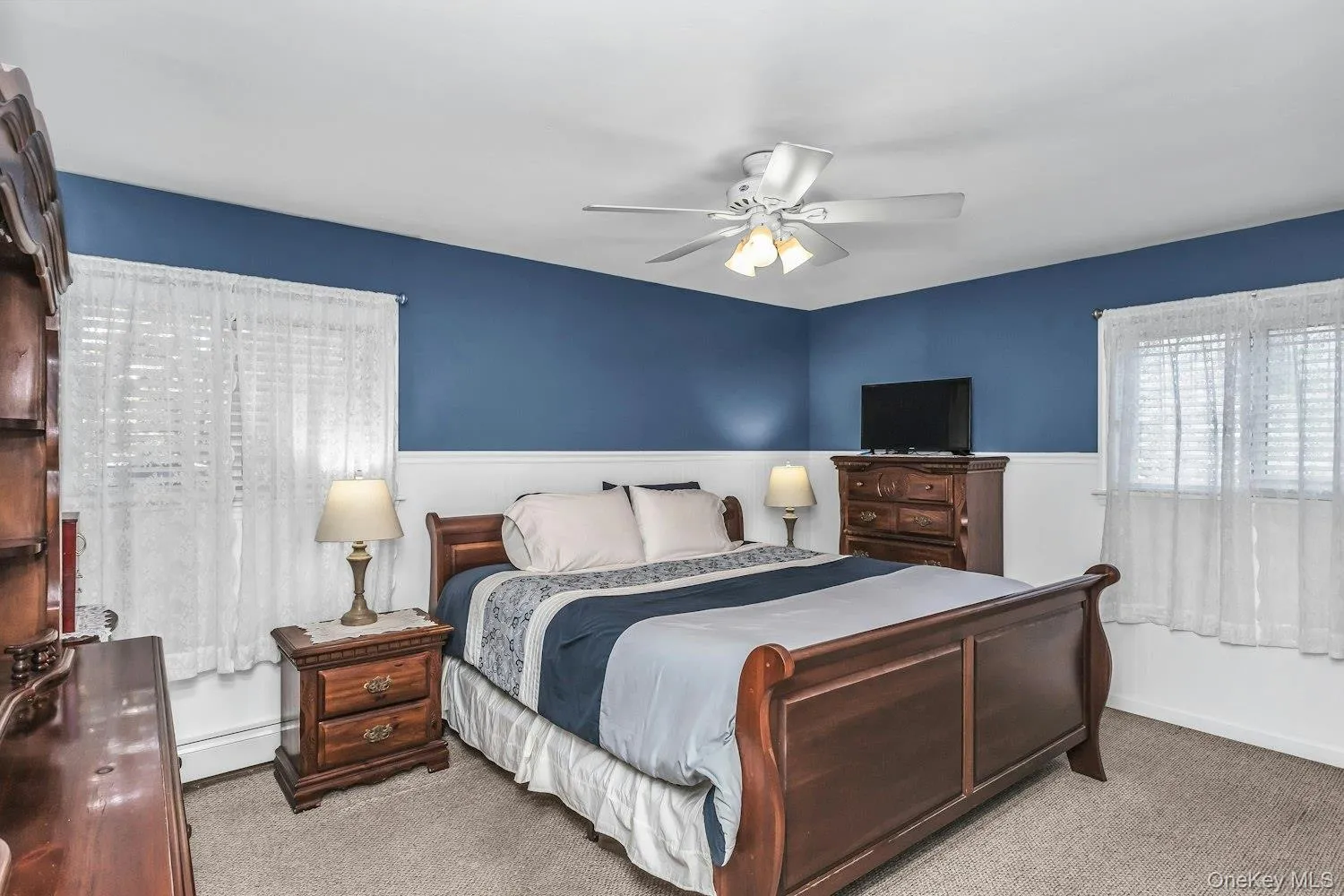 Primary Bedroom With Hard Wood Floors Under Carpet and Double Closet Primary Bedroom With Hard Wood Floors Under Carpet and Double Closet