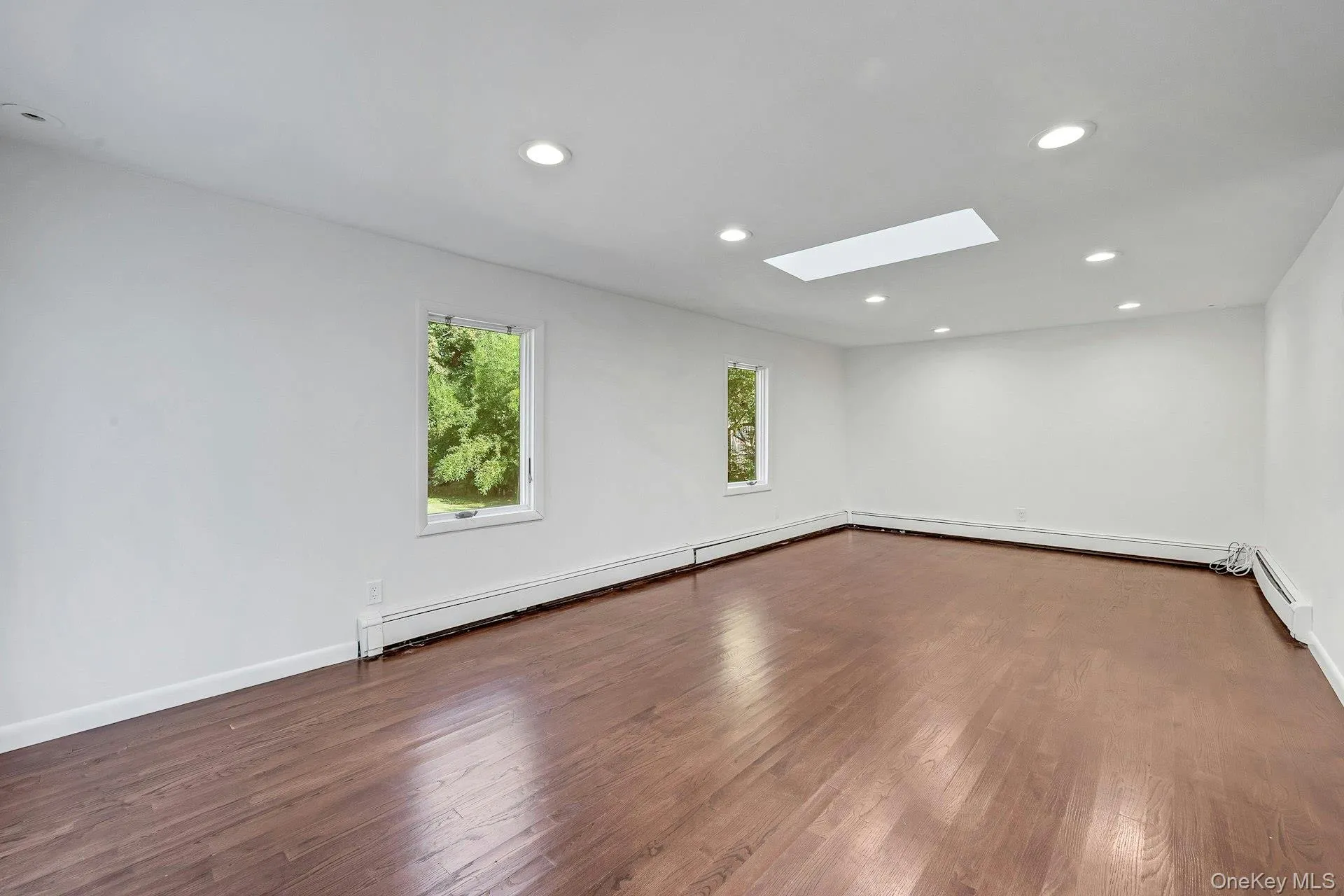 Spacious family room with skylight to maximize natural light Spacious family room with skylight to maximize natural light