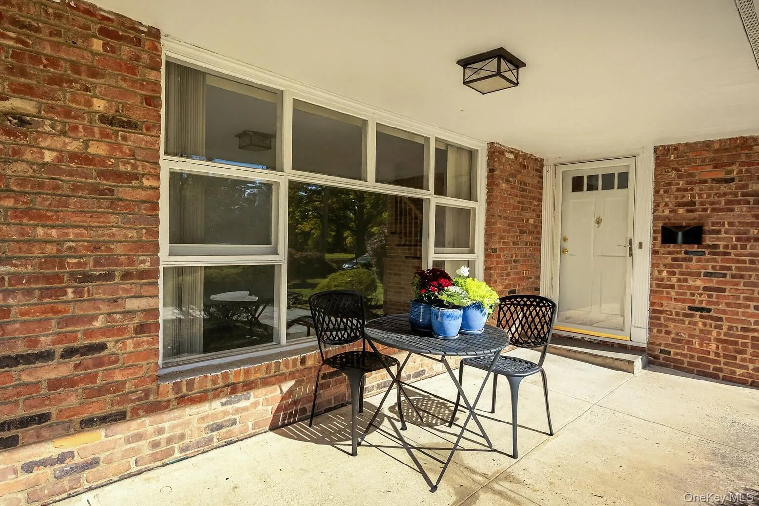 Large front patio for additional outdoor entertaining - Virtually staged Large front patio for additional outdoor entertaining - Virtually staged