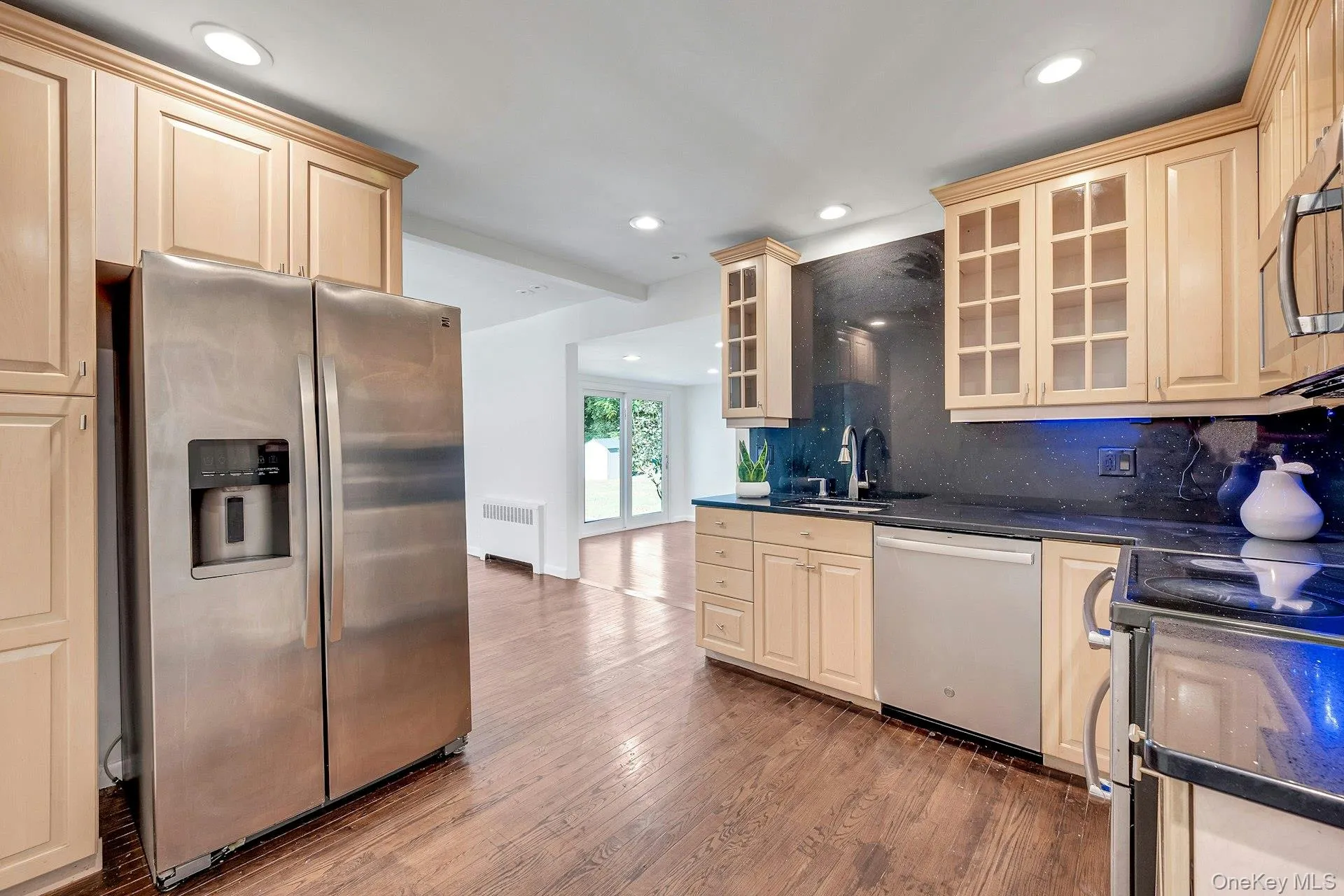 Kitchen with ease of flow into the dining and family rooms Kitchen with ease of flow into the dining and family rooms