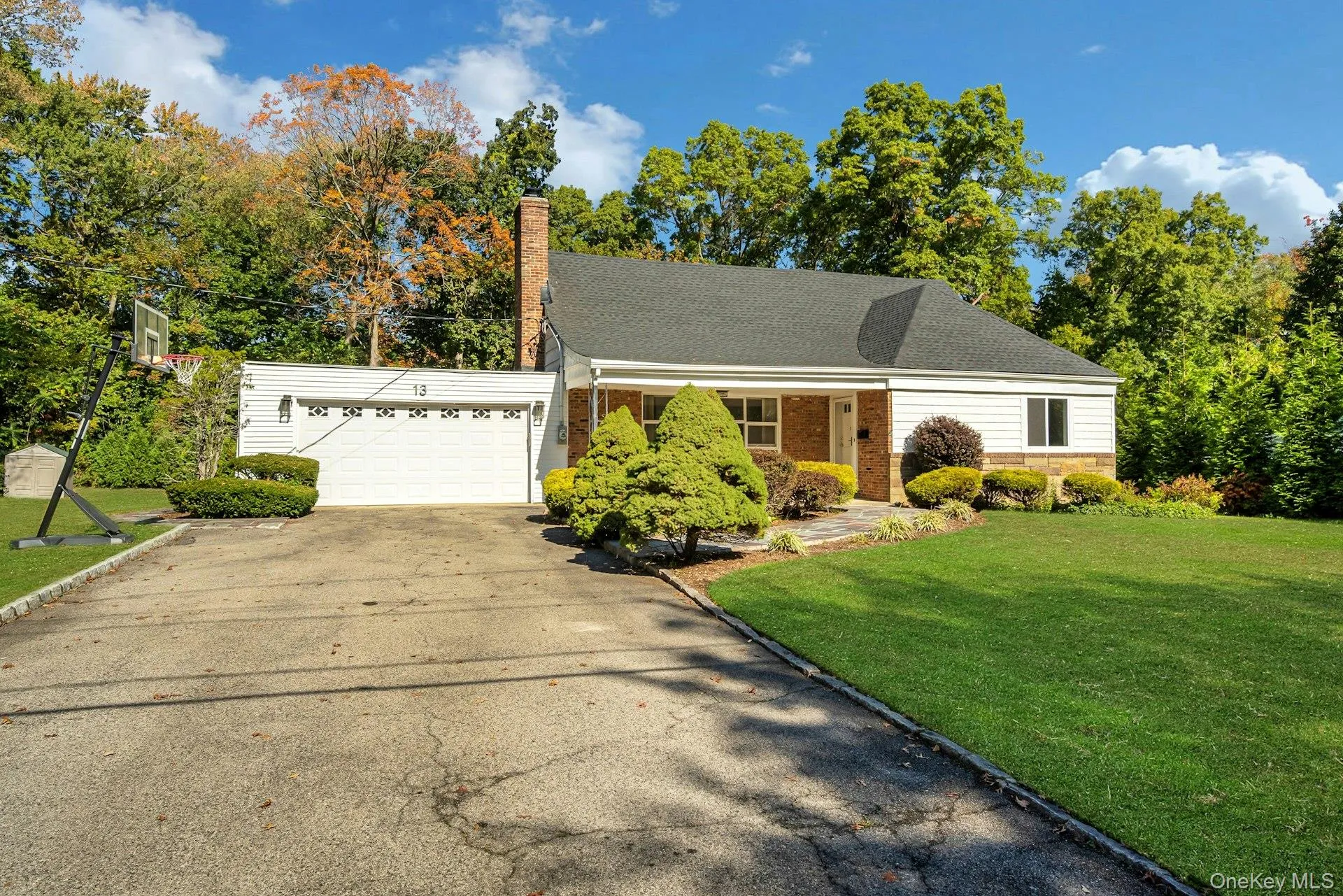 Two-car garage and large driveway with enough room for parking many vehicles Two-car garage and large driveway with enough room for parking many vehicles
