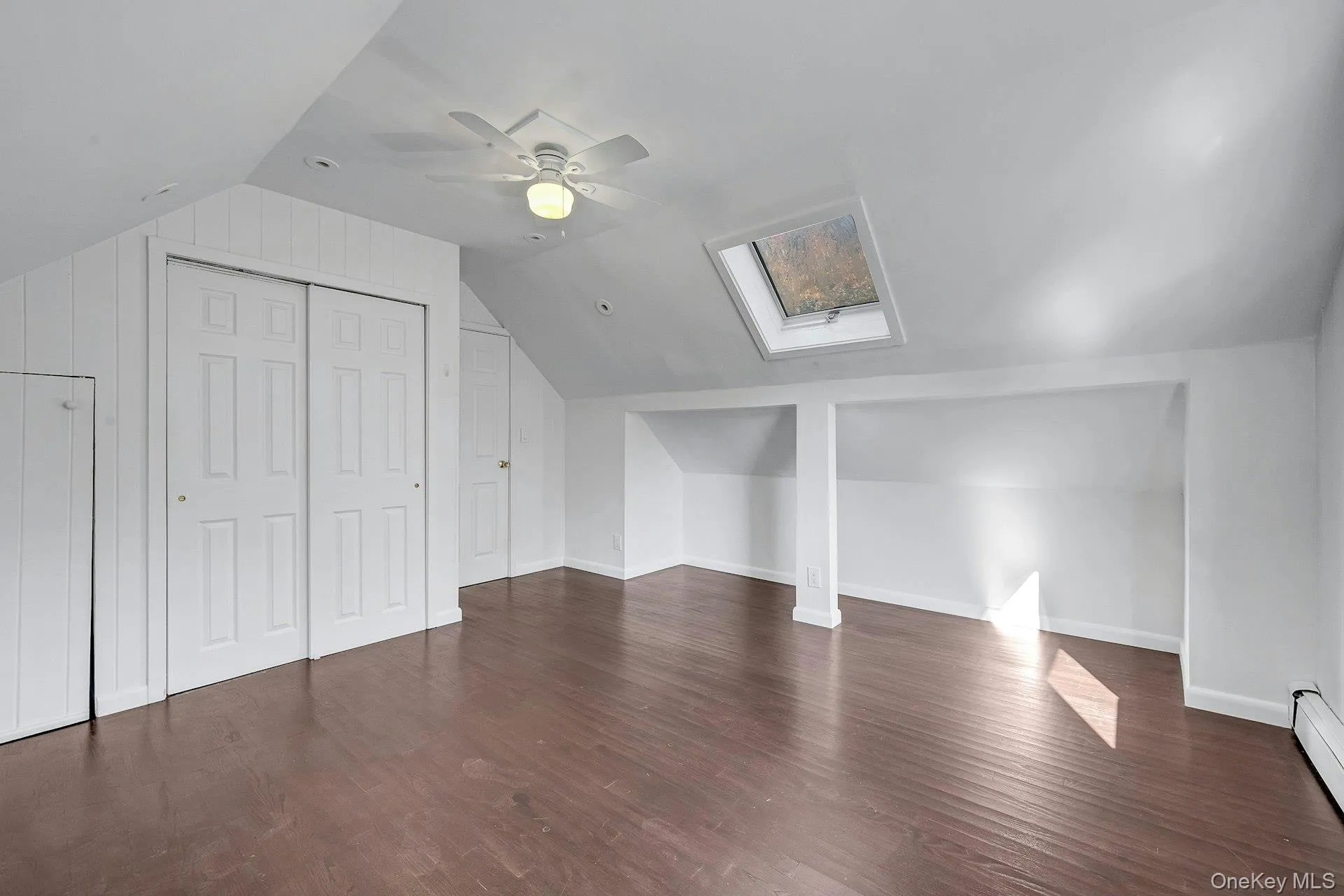 3rd bedroom with skylight and ceiling fan on 2nd floor 3rd bedroom with skylight and ceiling fan on 2nd floor