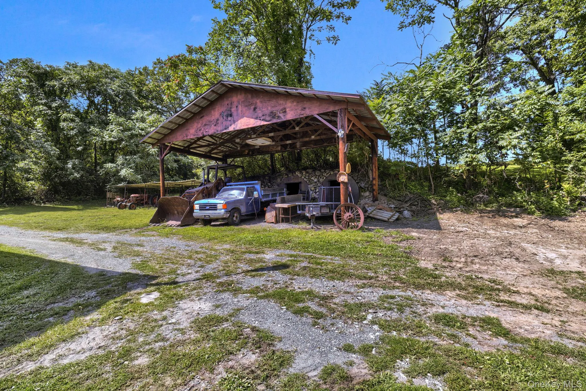 View of yard with a detached carport View of yard with a detached carport