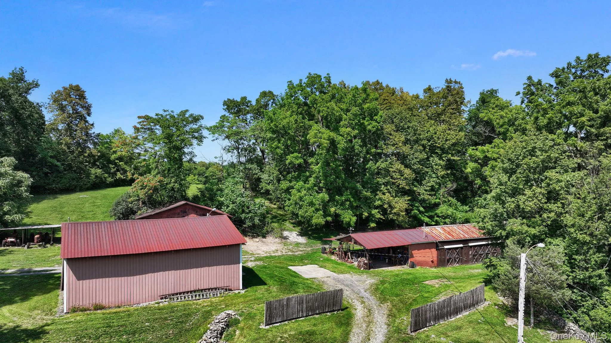 View from above of property with a heavily wooded area View from above of property with a heavily wooded area