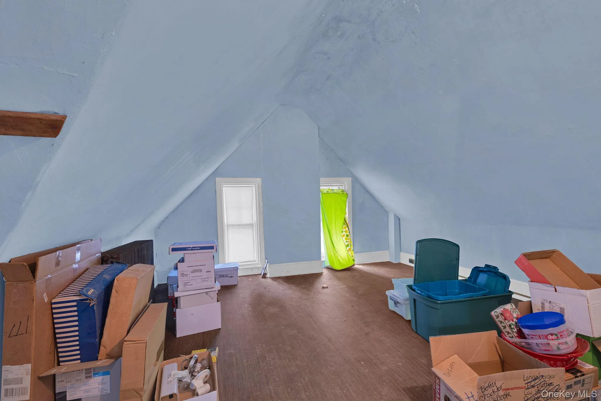 Additional living space with wood finished floors and lofted ceiling Additional living space with wood finished floors and lofted ceiling