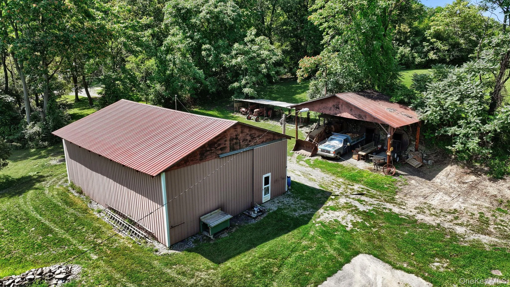 View from above of property featuring a tree filled landscape View from above of property featuring a tree filled landscape