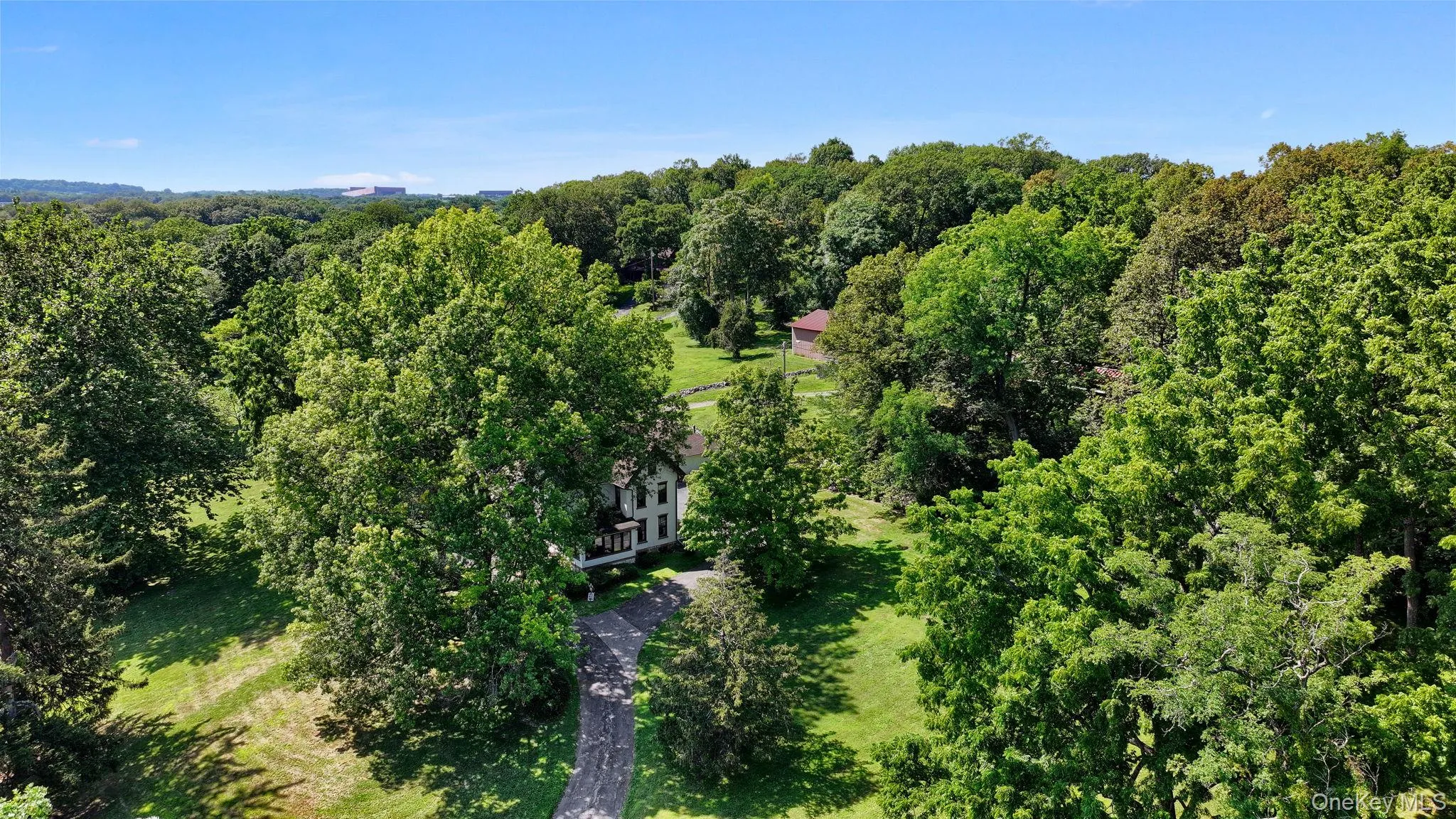 View of property location featuring a heavily wooded area View of property location featuring a heavily wooded area