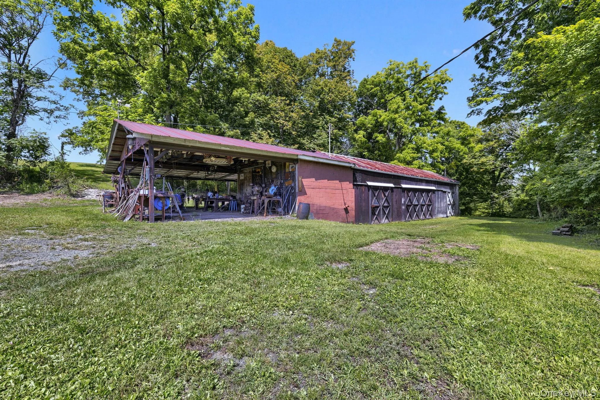 View of green lawn with an outbuilding View of green lawn with an outbuilding