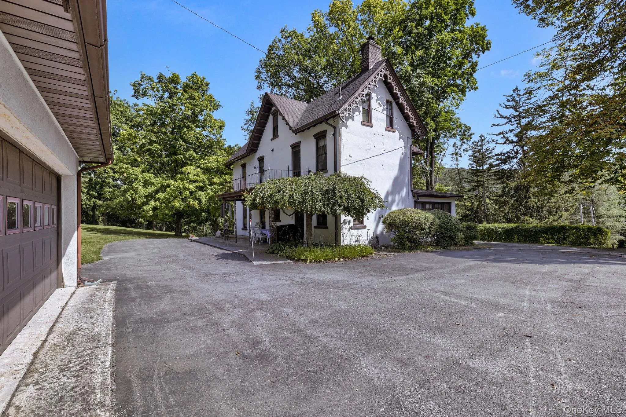 View of side of property with a chimney and stucco siding View of side of property with a chimney and stucco siding