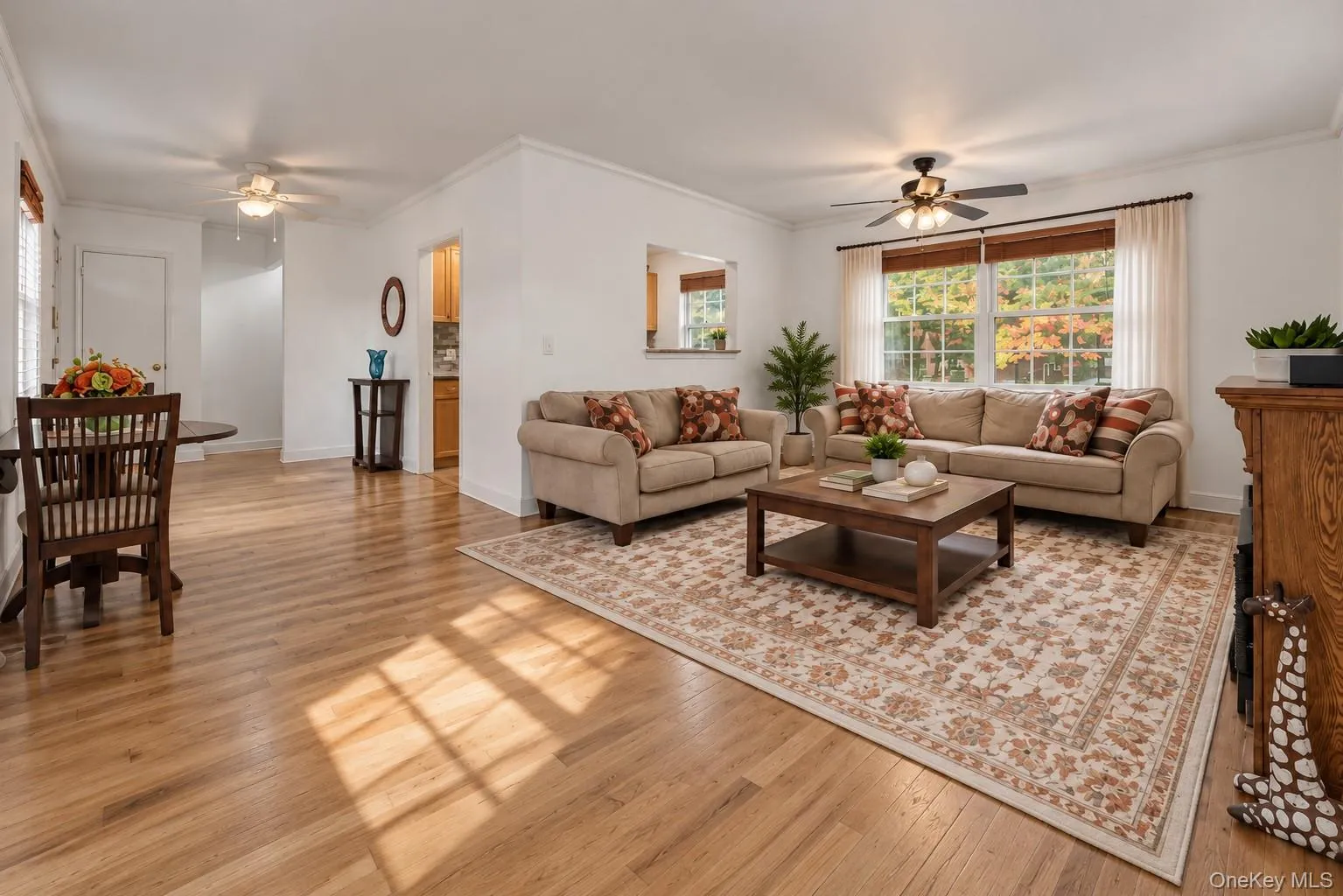 Living Room Features: Home Office Area, Ceiling Fans, Hardwood Floors, Grand Window View, Natural Light, Stand-Alone Fireplace Living Room Features: Home Office Area, Ceiling Fans, Hardwood Floors, Grand Window View, Natural Light, Stand-Alone Fireplace