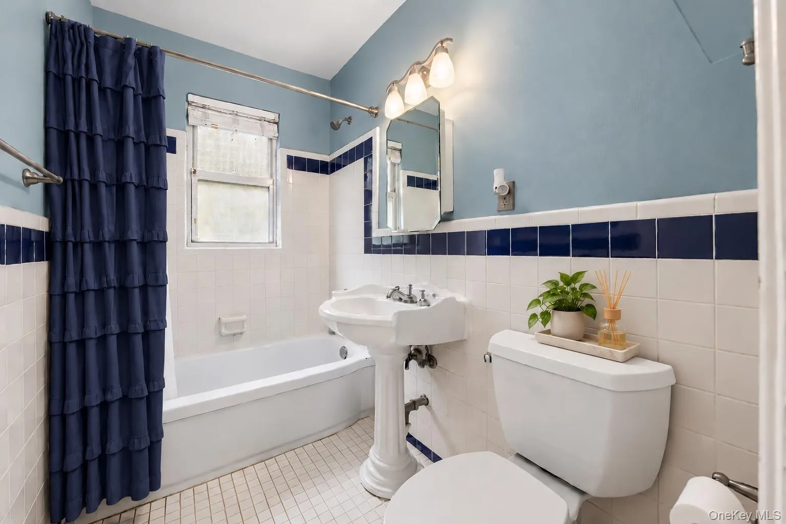 Bath Features: Window, Sleek Modern Lighting, Pedestal Sink Bath Features: Window, Sleek Modern Lighting, Pedestal Sink
