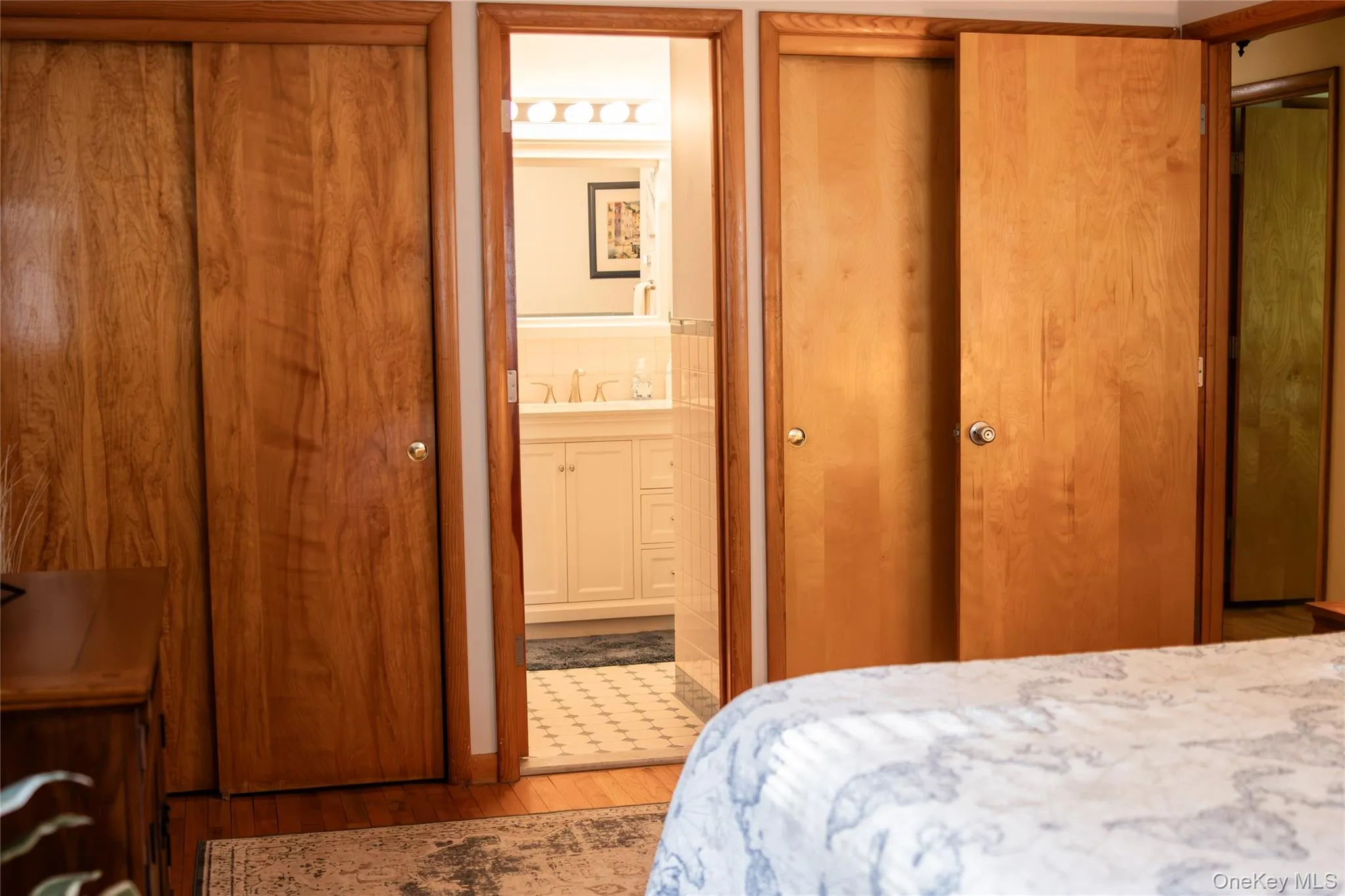 Double closets in 1st main level bedroom, with access to full bathroom Double closets in 1st main level bedroom, with access to full bathroom