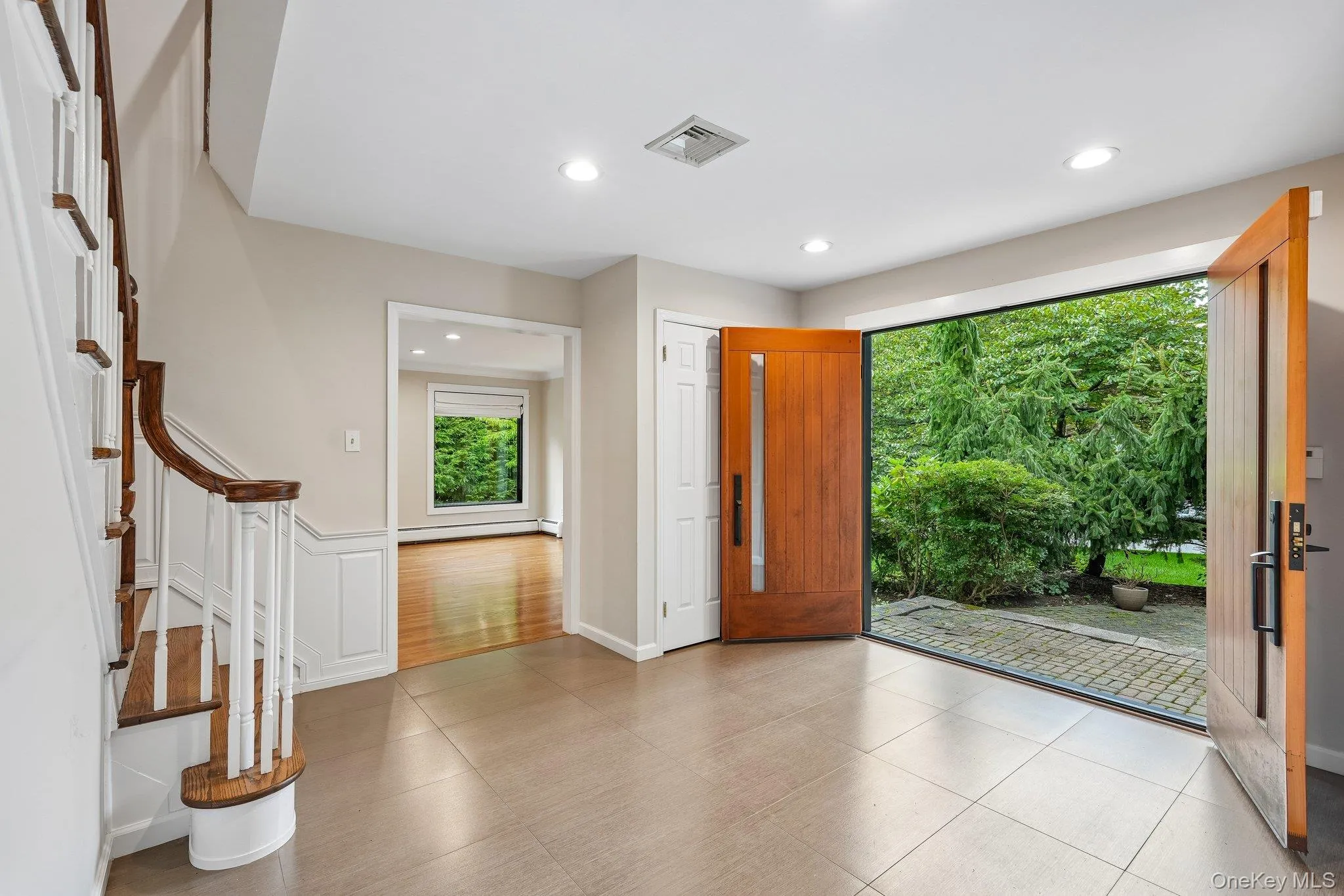 Double door entry flanked with double coat closets Double door entry flanked with double coat closets