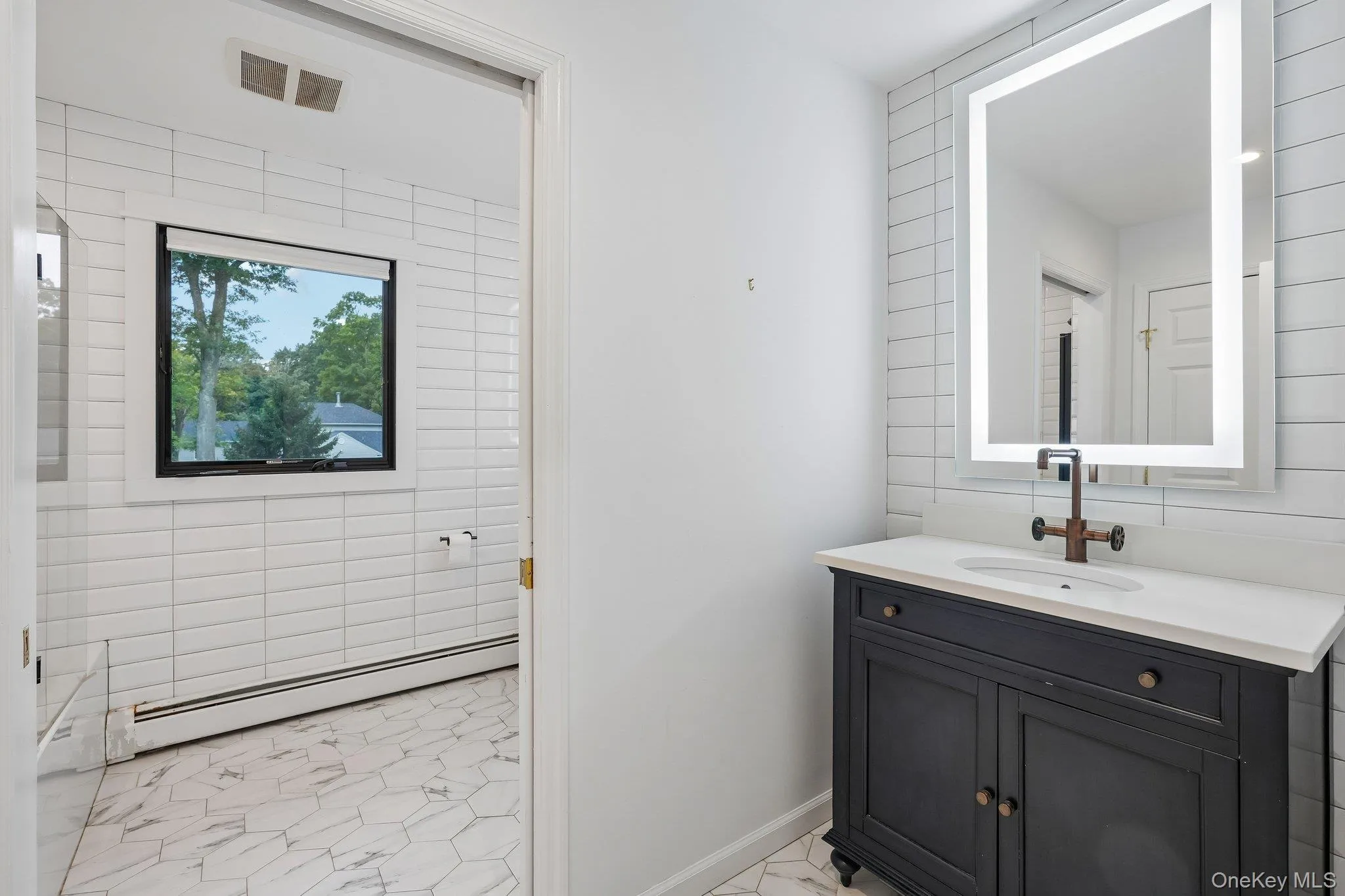 Main bathroom with pocket door partition from toilet & tub Main bathroom with pocket door partition from toilet & tub
