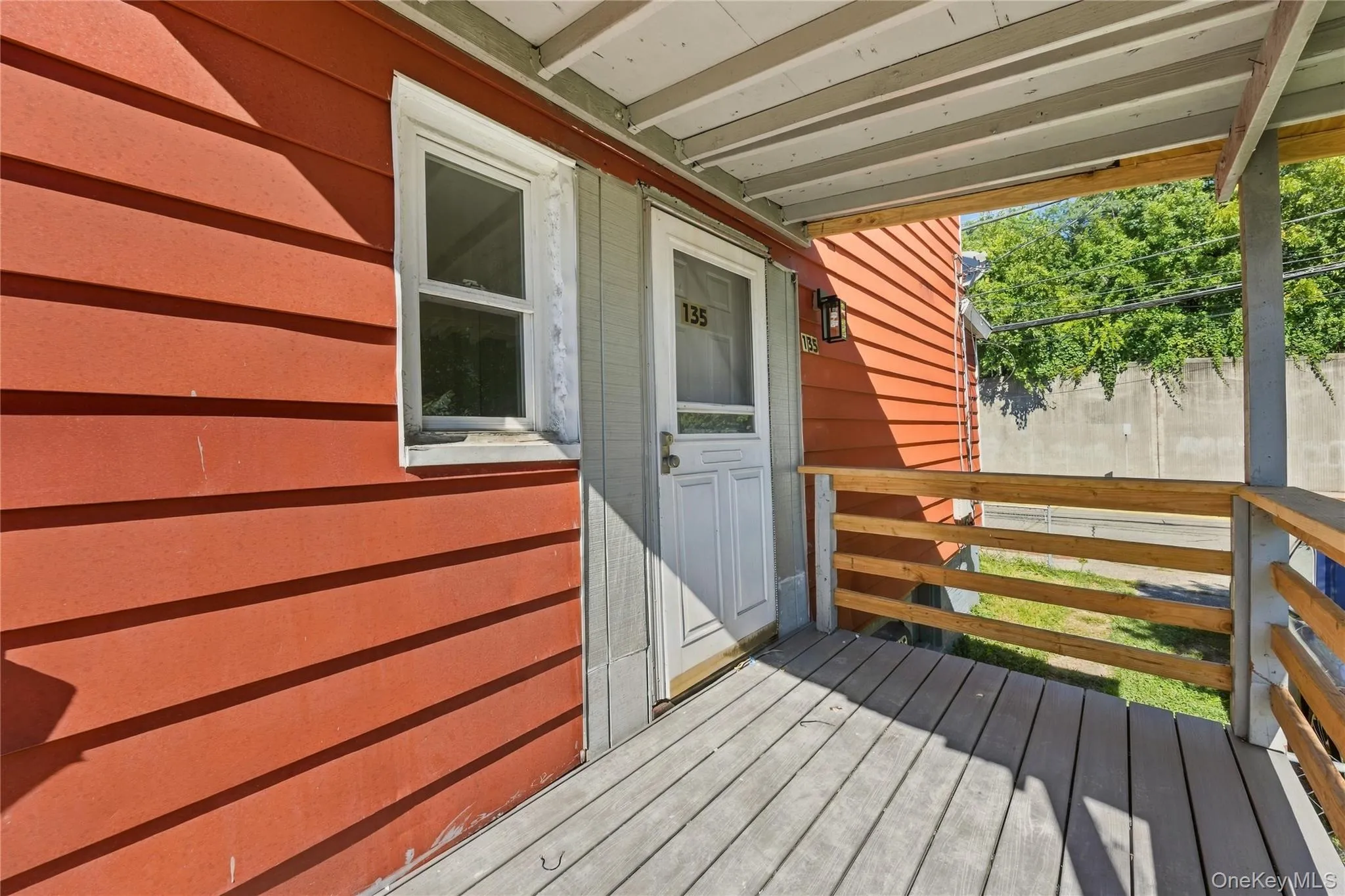 Side entrance with a big deck Side entrance with a big deck
