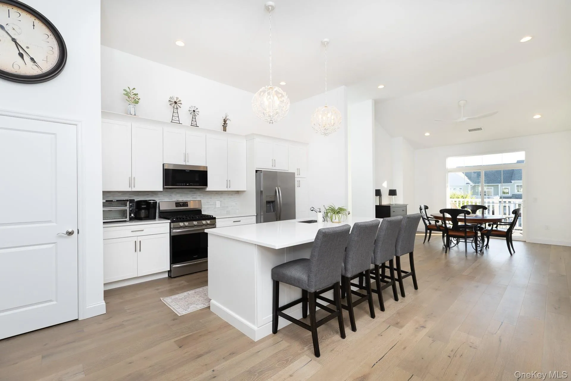 Island Kitchen Featuring Quartz Countertops and Stainless Steel Appliances Island Kitchen Featuring Quartz Countertops and Stainless Steel Appliances