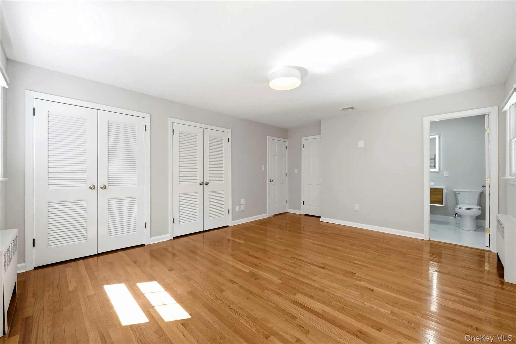 Primary bedroom with three closets including walk-in Primary bedroom with three closets including walk-in