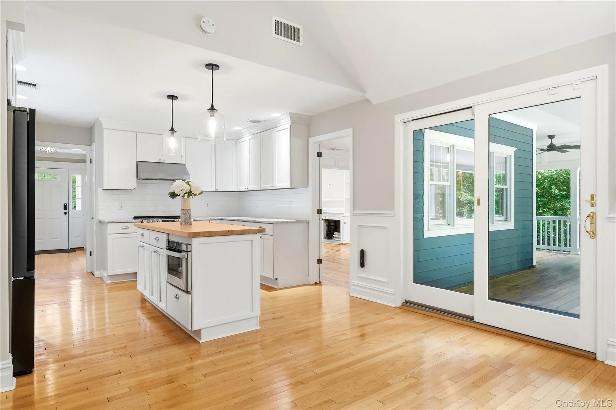 Kitchen with sliders to covered porch Kitchen with sliders to covered porch