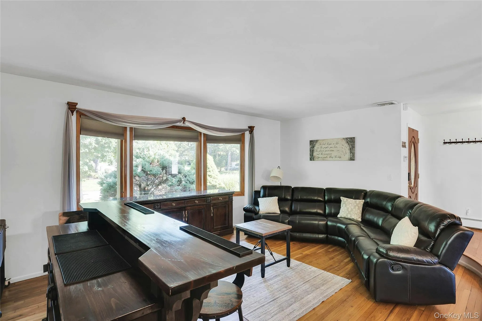 Sunken living room with a lot of natural light. Sunken living room with a lot of natural light.