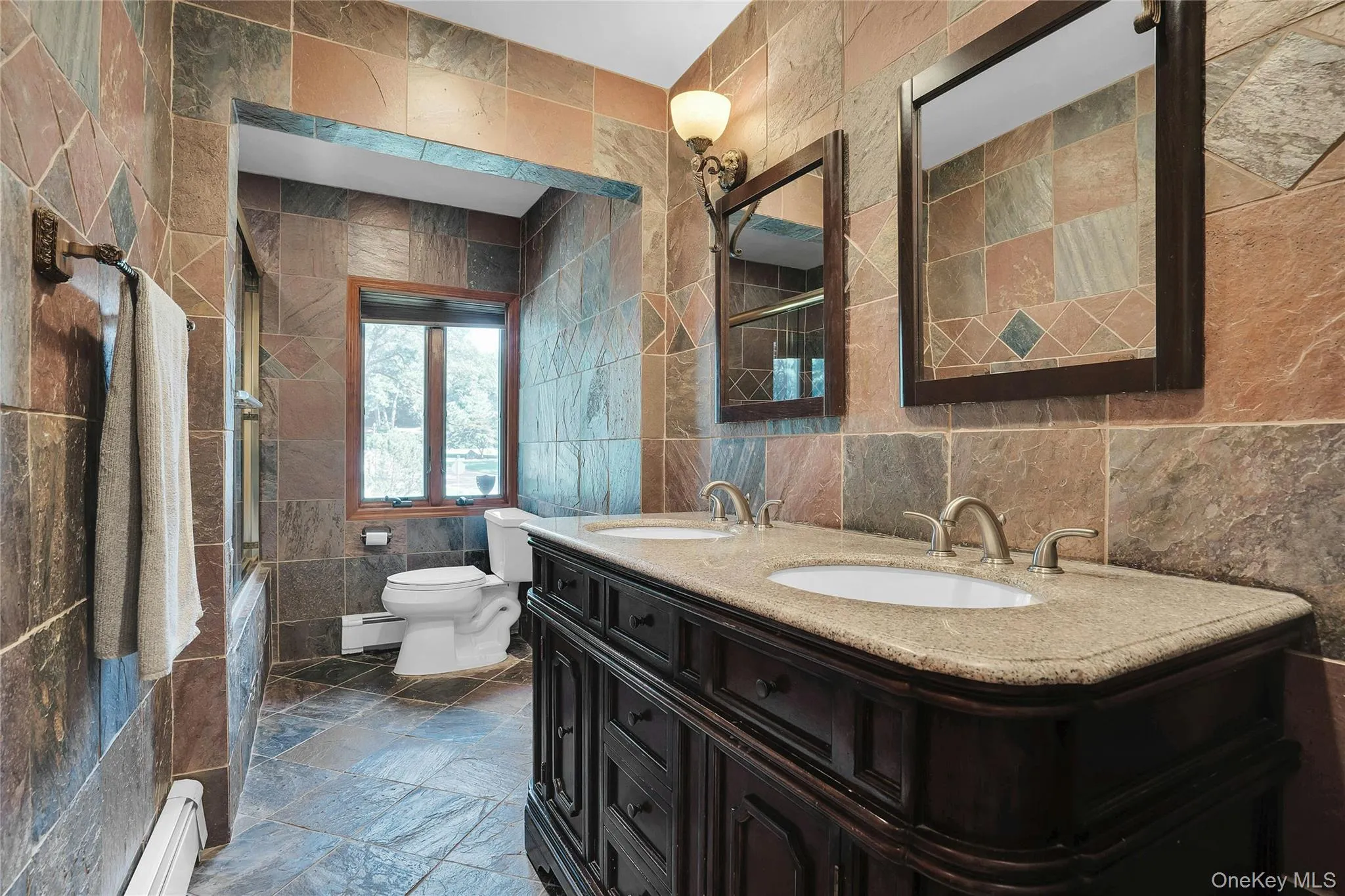 Beautifully updated bathroom with double sinks. Beautifully updated bathroom with double sinks.
