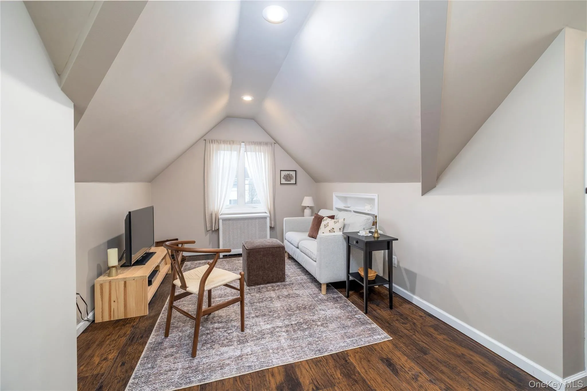 Office space featuring baseboards, vaulted ceiling, recessed lighting, and dark wood finished floors Office space featuring baseboards, vaulted ceiling, recessed lighting, and dark wood finished floors