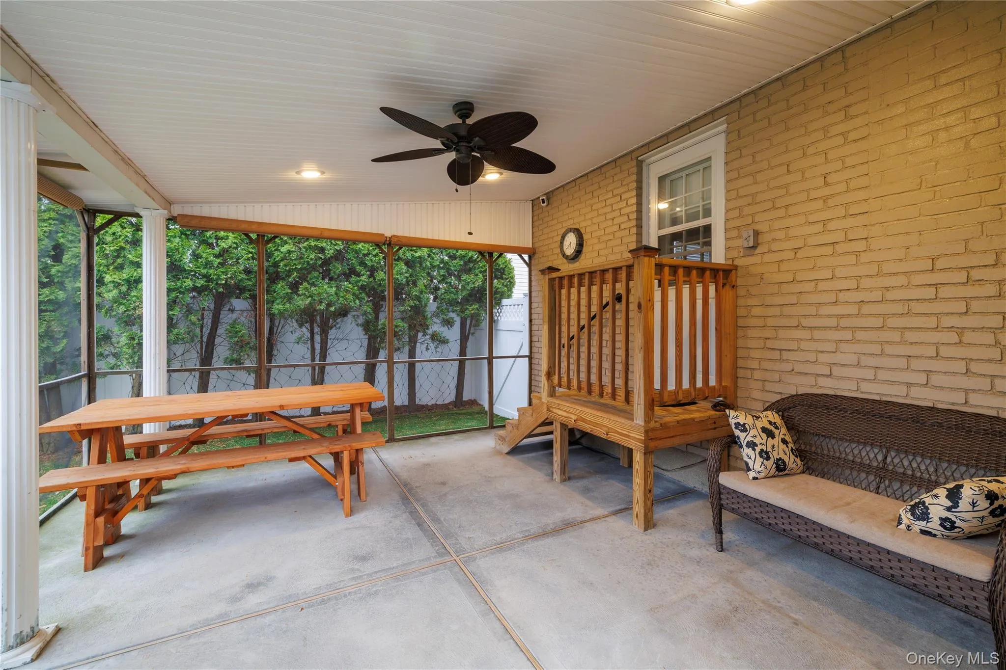 View of patio with ceiling fan and fence View of patio with ceiling fan and fence