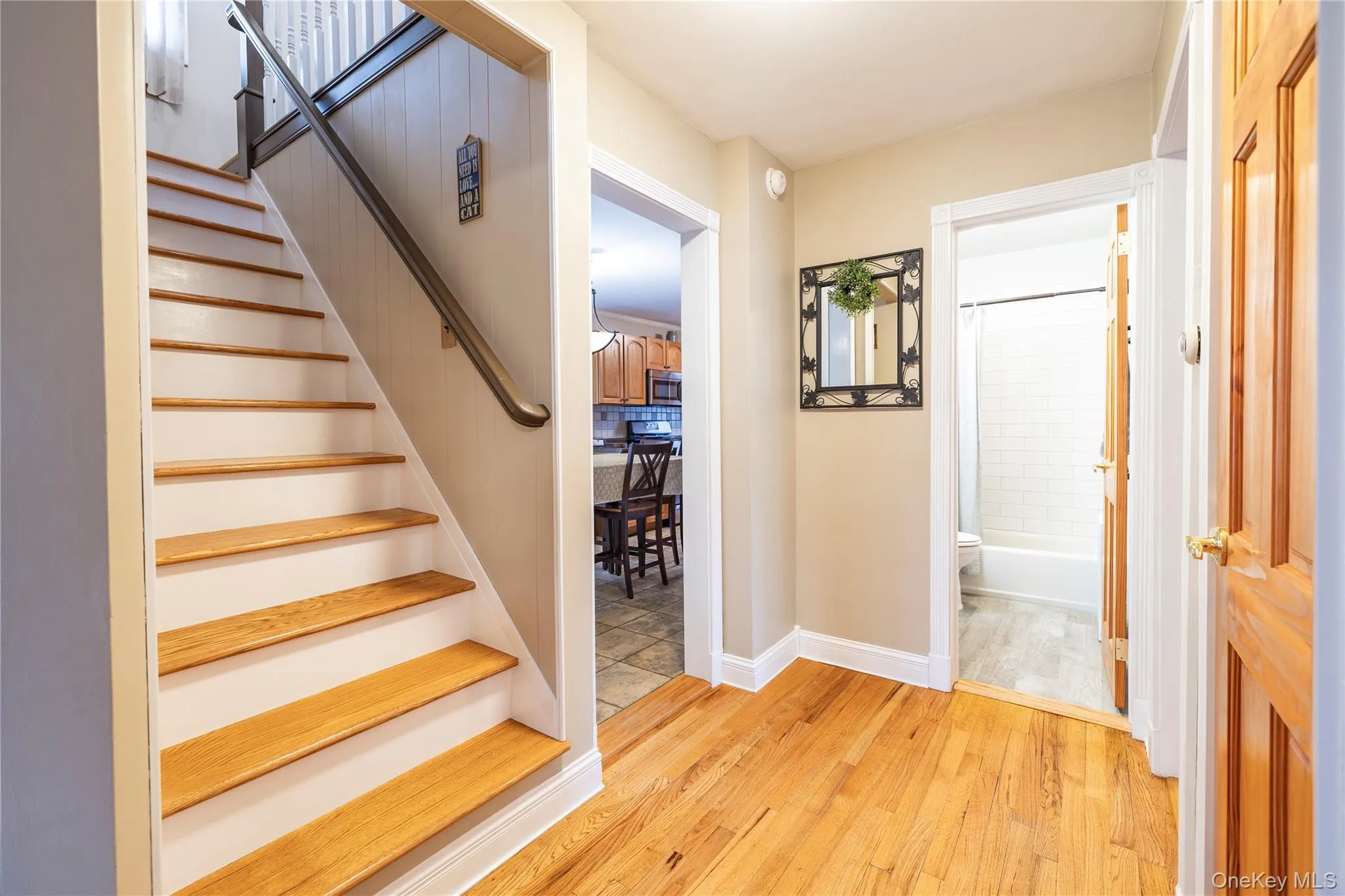Stairs with baseboards and wood finished floors Stairs with baseboards and wood finished floors