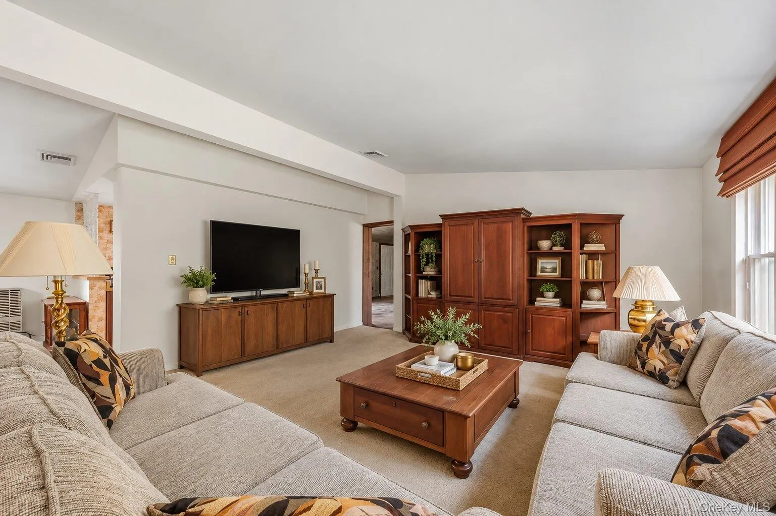 Large living room with ample wall space for entertainment and plenty of room for multiple seating areas. Large living room with ample wall space for entertainment and plenty of room for multiple seating areas.
