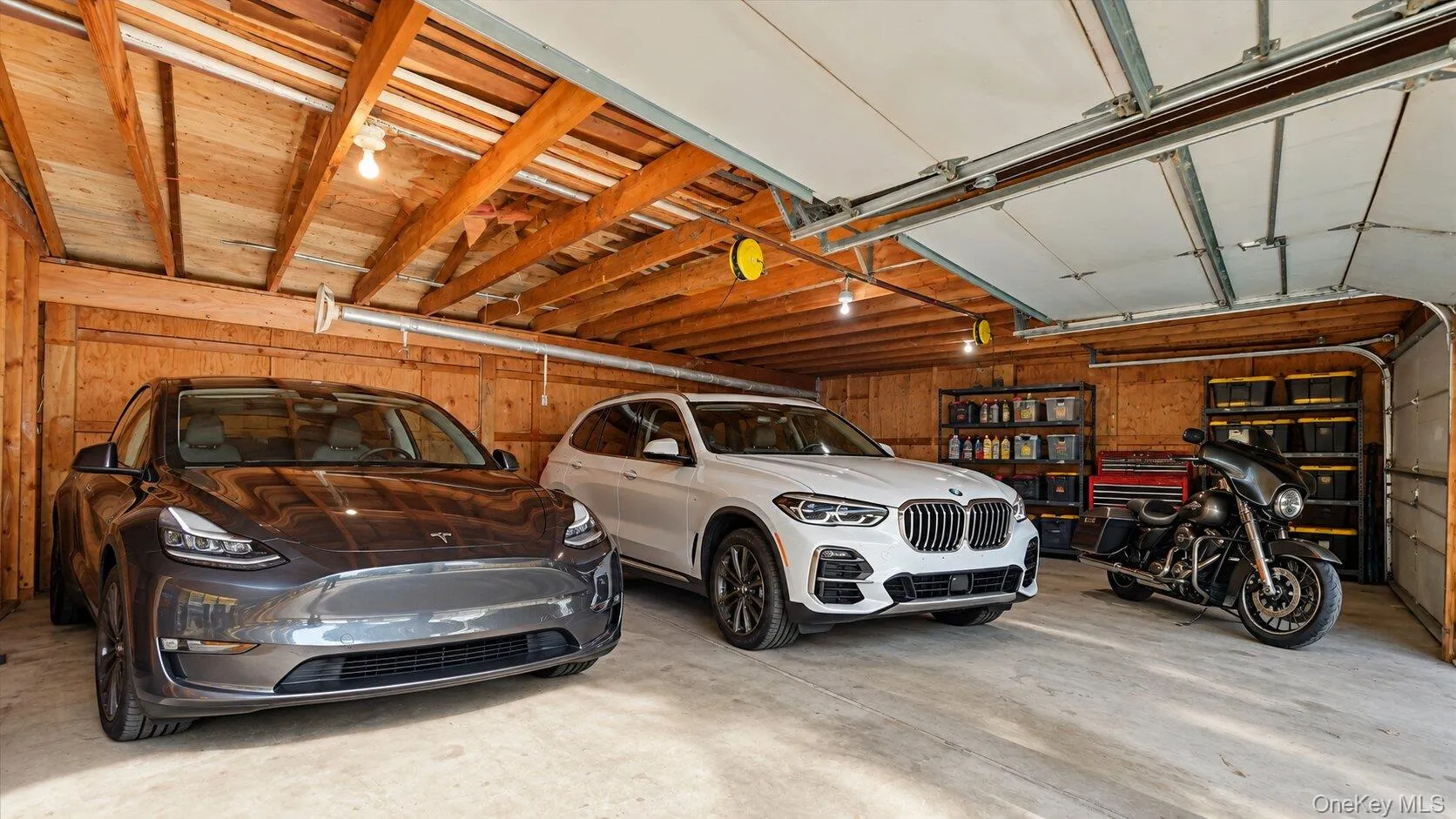 Virtually Staged garage highlighting the generous floor area, vehicle capacity, and storage potential. Virtually Staged garage highlighting the generous floor area, vehicle capacity, and storage potential.