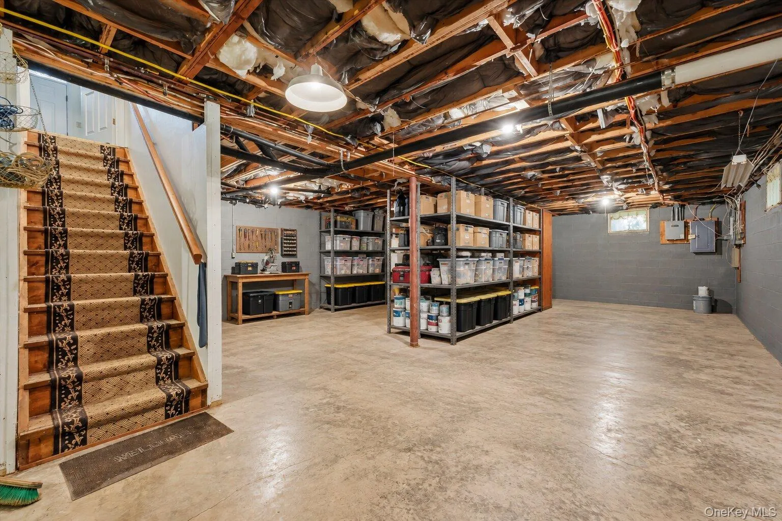 Virtually Staged. Basement showcasing the generous open space, storage areas, and workshop potential. Virtually Staged. Basement showcasing the generous open space, storage areas, and workshop potential.