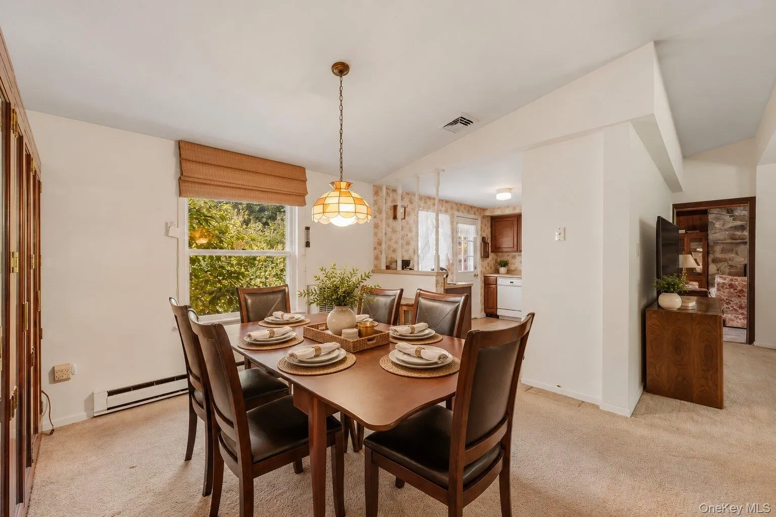 Virtually Staged. Bright dining area with a large window, comfortable seating space, and direct access to the nearby kitchen. Virtually Staged. Bright dining area with a large window, comfortable seating space, and direct access to the nearby kitchen.