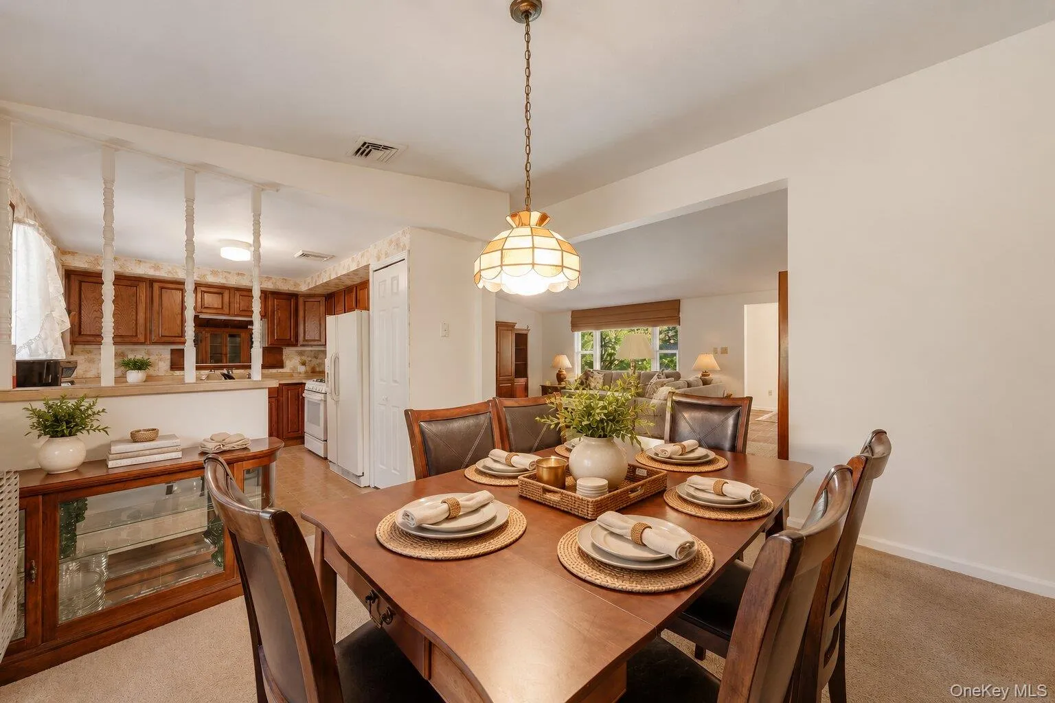Virtually Staged. Dining area with a classic light fixture, generous table space, and easy flow into the kitchen and living room. Virtually Staged. Dining area with a classic light fixture, generous table space, and easy flow into the kitchen and living room.