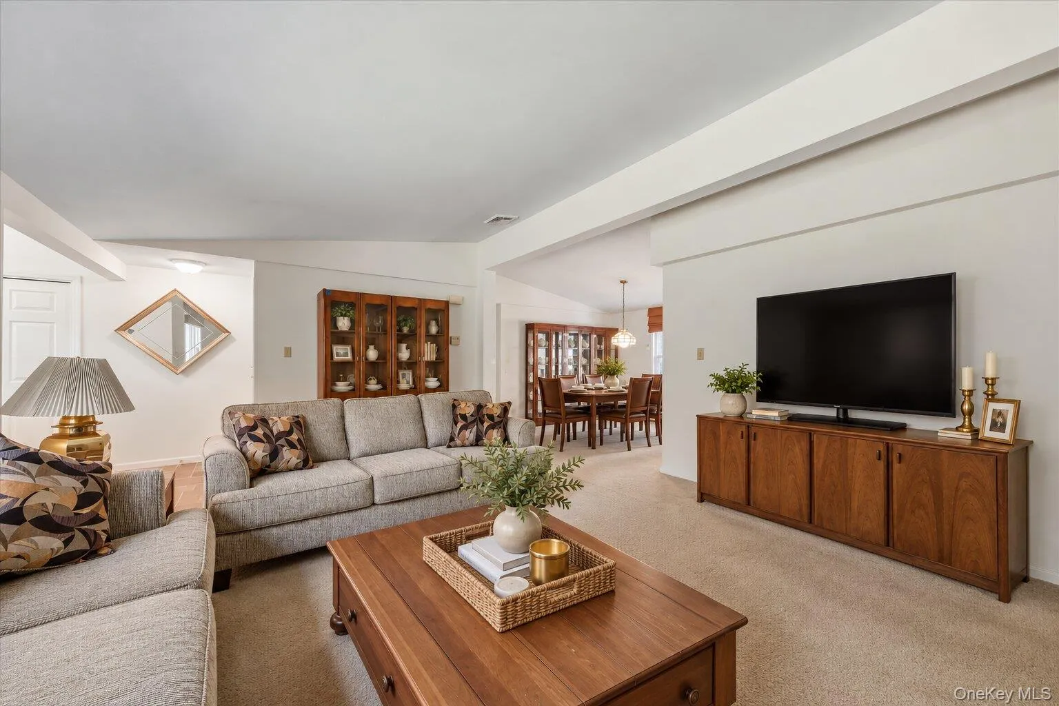 Spacious living room with generous seating space and an open connection to the adjacent dining area. Spacious living room with generous seating space and an open connection to the adjacent dining area.